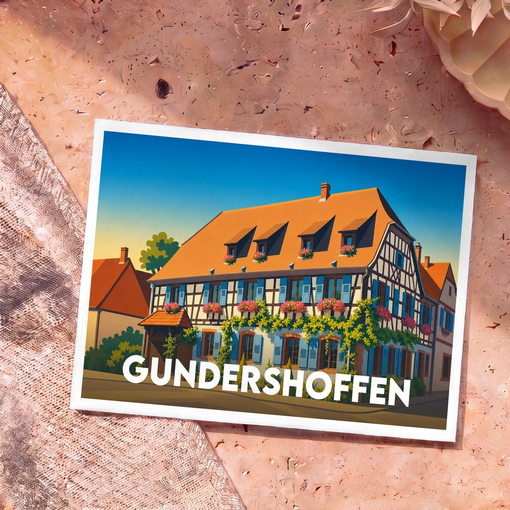 Carte postale souvenir de la ville de Gundershoffen avec une illustration stylisée d'une maison à colombages fleurie.