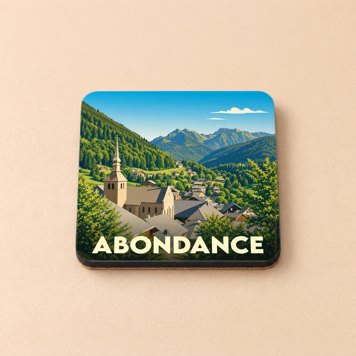 Dessous de verre souvenir de la ville d'Abondance avec une illustration stylisée de son église et des montagnes.