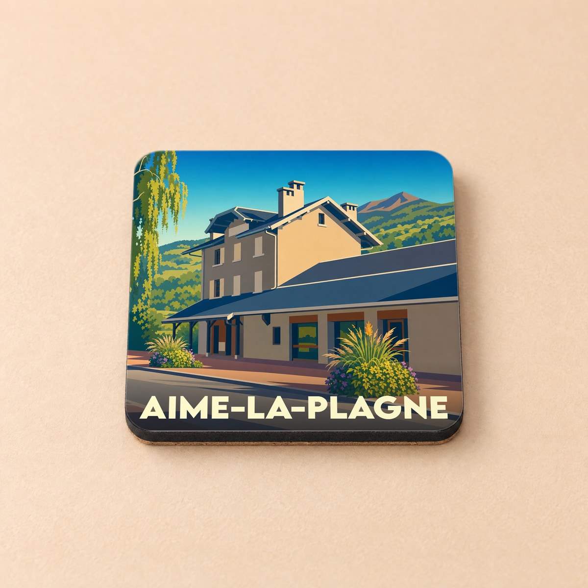 Dessous de verre souvenir de la ville d'Aime-la-Plagne avec une illustration stylisée de sa gare.