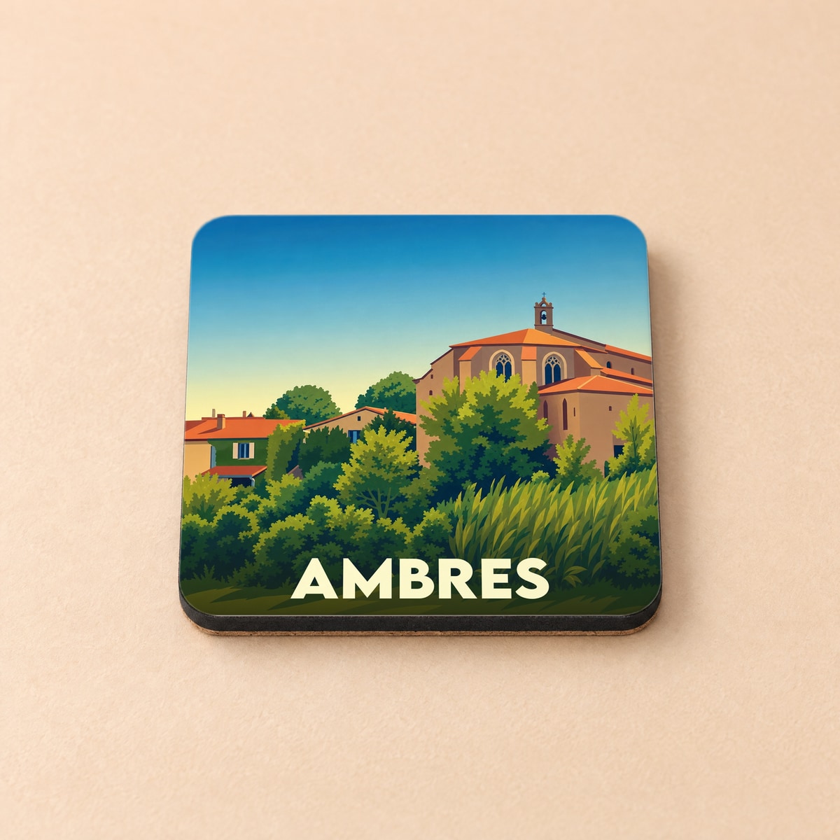Dessous de verre souvenir de la ville de Ambres avec une illustration stylisée de son église et de ses paysages.