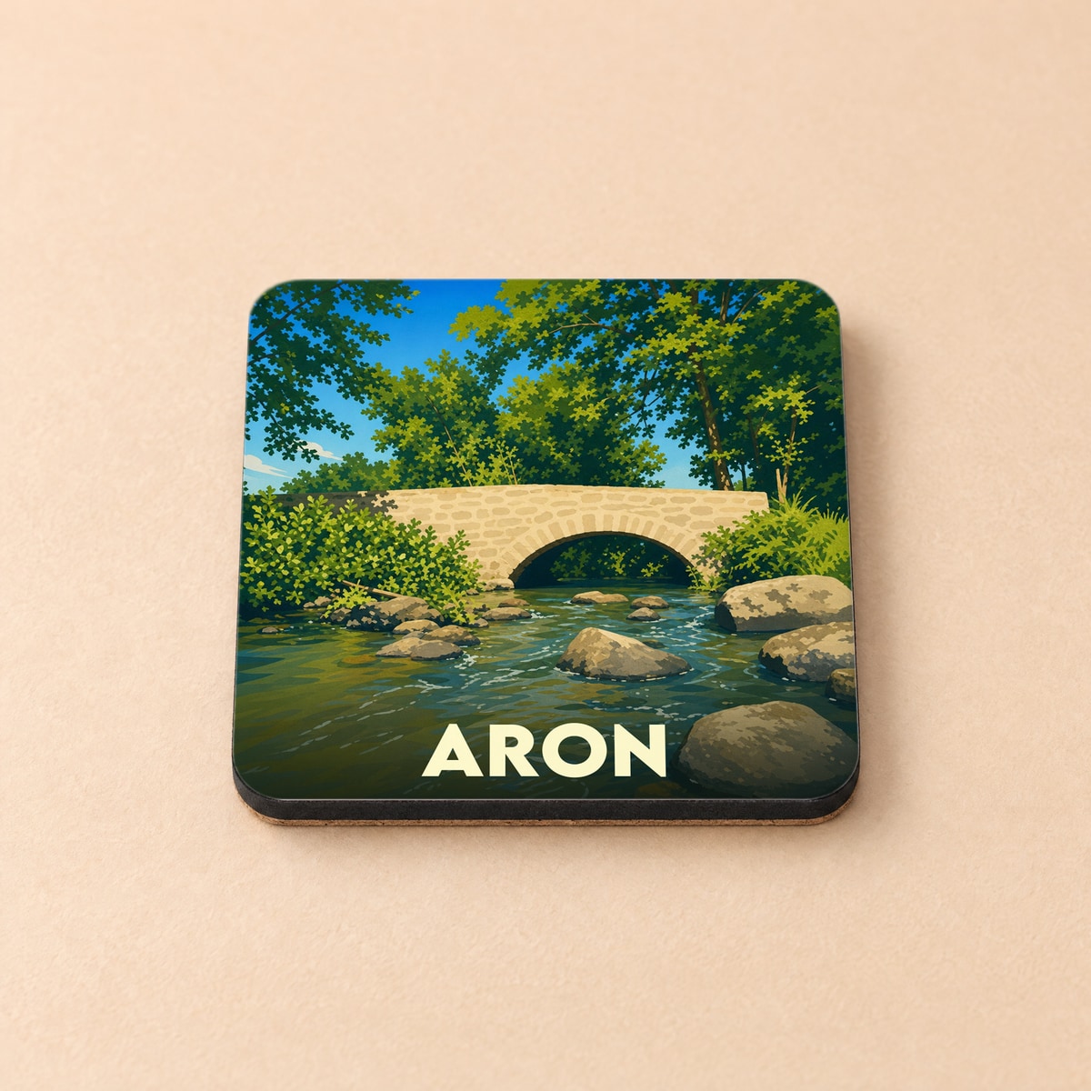 Dessous de verre souvenir de la ville de Aron avec une illustration stylisée d'un pont en pierre.