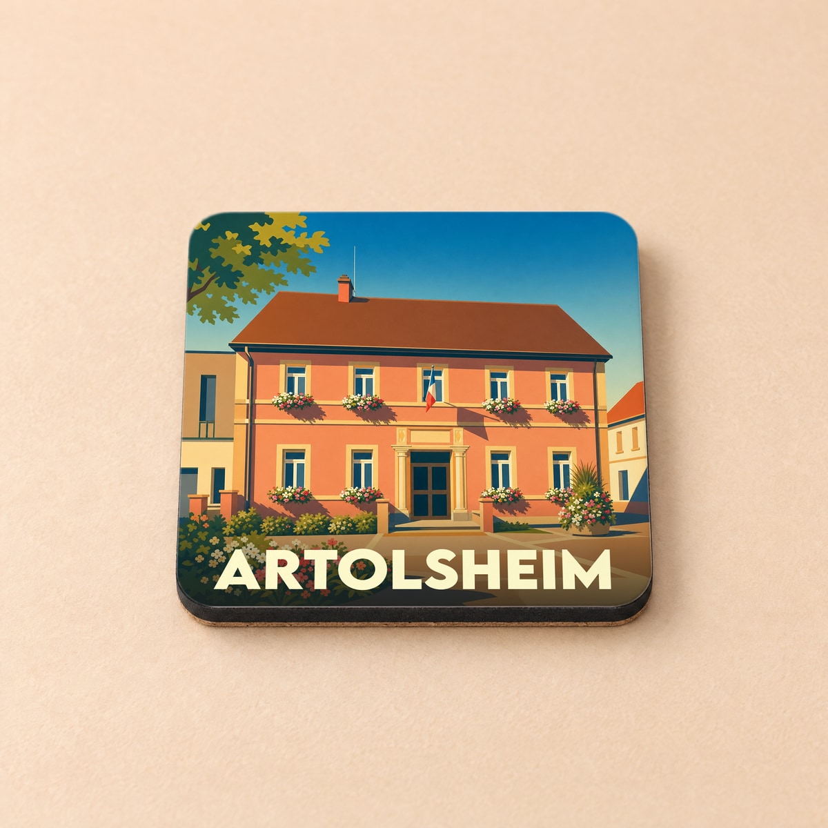 Dessous de verre souvenir de la ville d'Artolsheim avec une illustration stylisée d'un bâtiment fleuri.