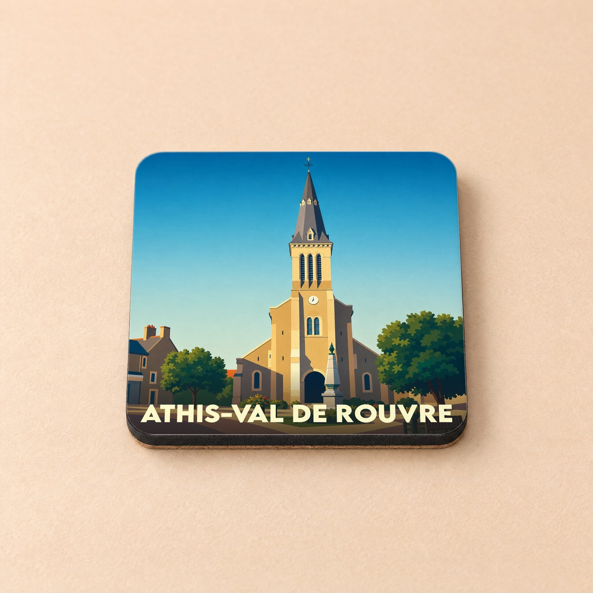 Dessous de verre souvenir de la ville d'Athis-Val de Rouvre avec une illustration stylisée de son église.