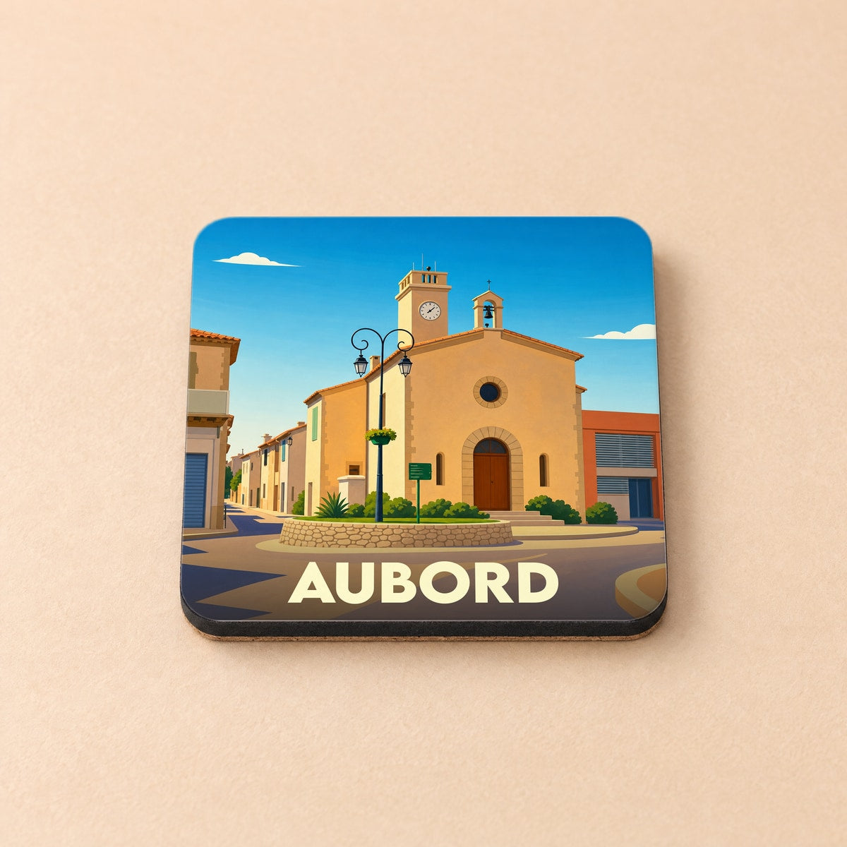 Dessous de verre souvenir de la ville d'Aubord avec une illustration stylisée de sa place centrale.