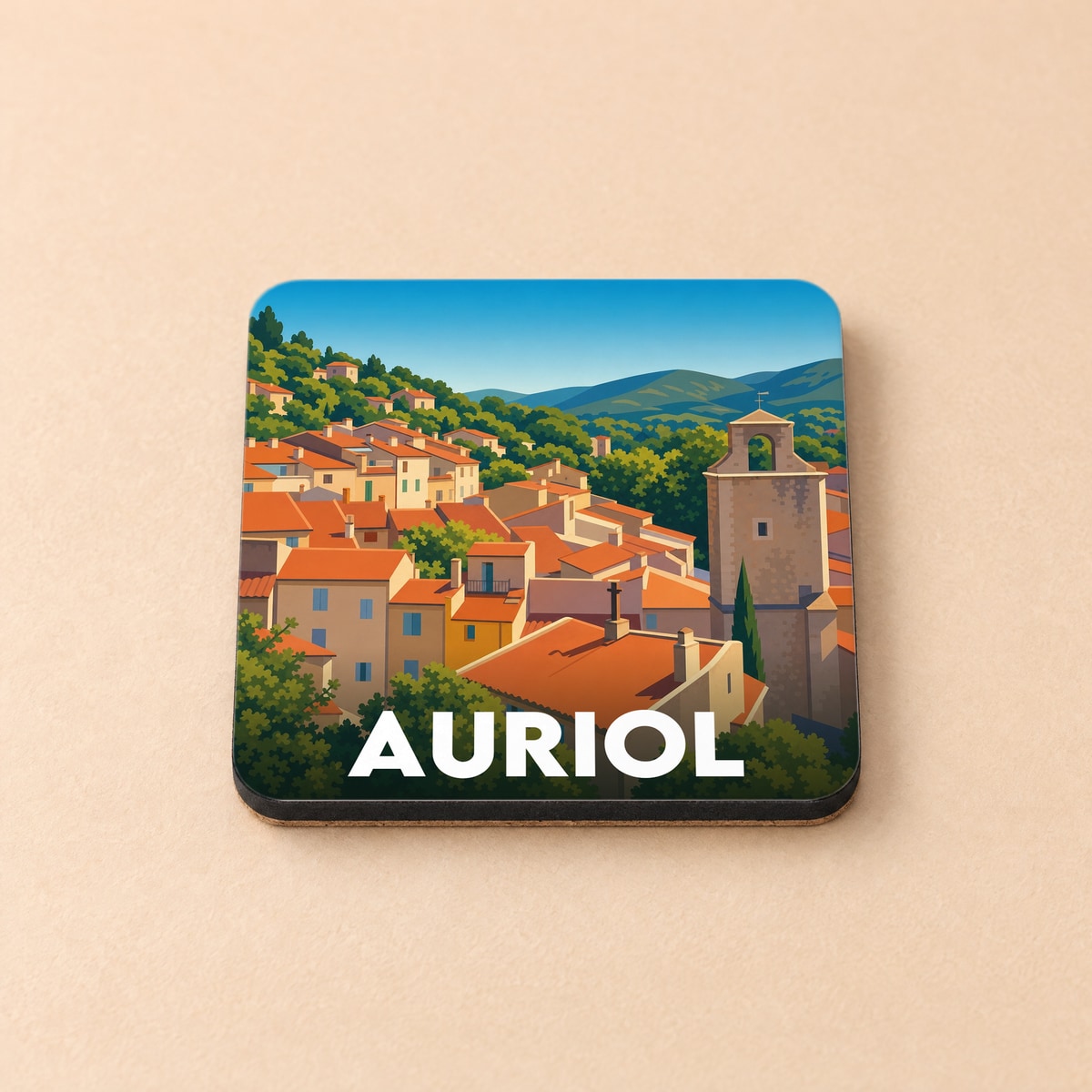 Dessous de verre souvenir de la ville d'Auriol avec une illustration stylisée de ses toits provençaux et de son clocher.