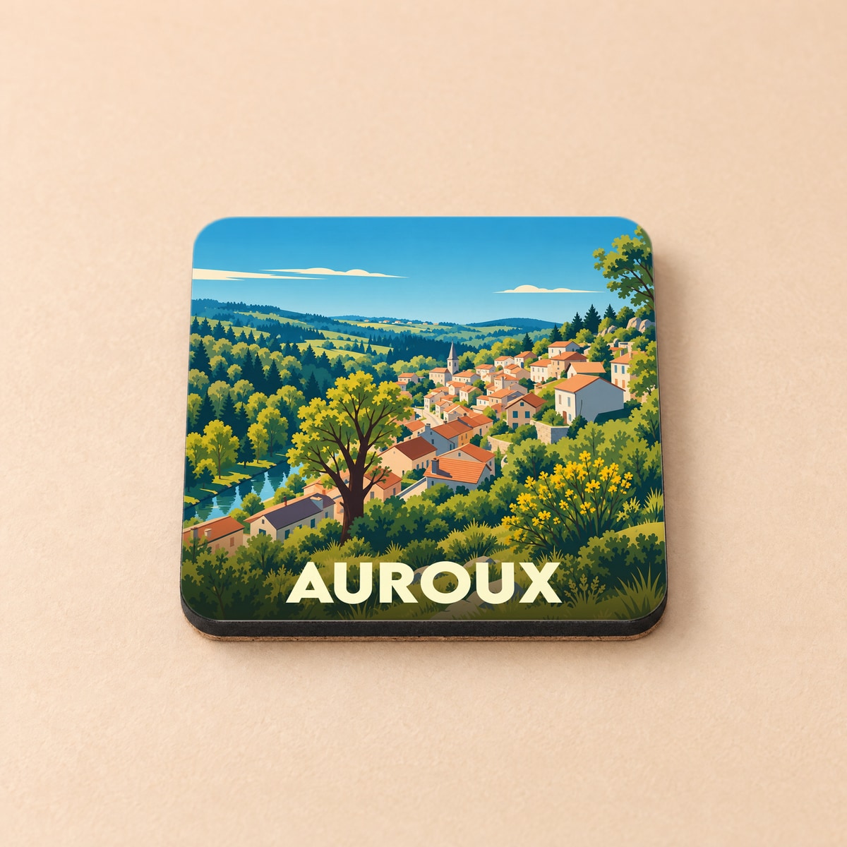 Dessous de verre souvenir de la ville d'Auroux illustré d'un paysage de campagne vallonné et coloré.