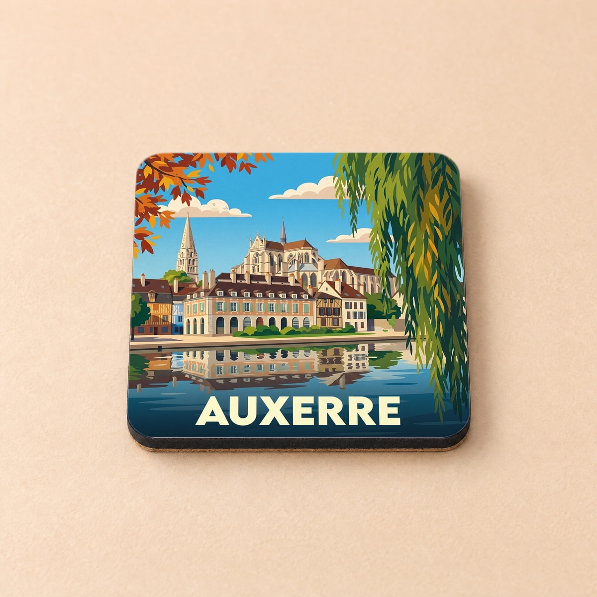 Dessous de verre souvenir de la ville d'Auxerre avec une illustration stylisée des bords de l'Yonne.