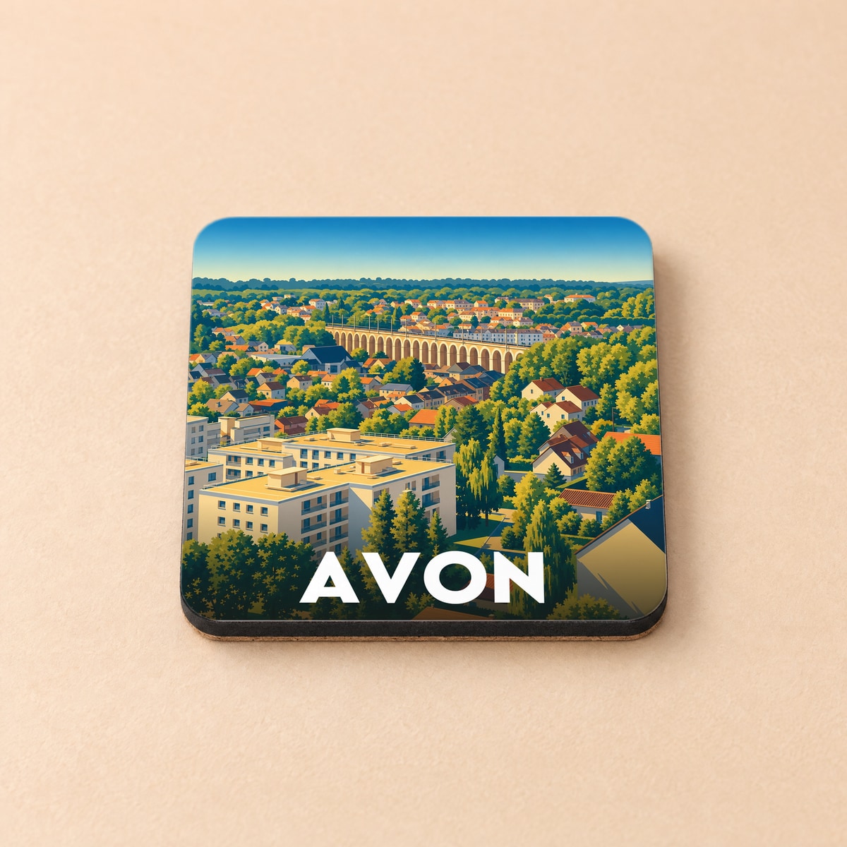 Dessous de verre souvenir de la ville d'Avon avec une illustration stylisée et colorée.