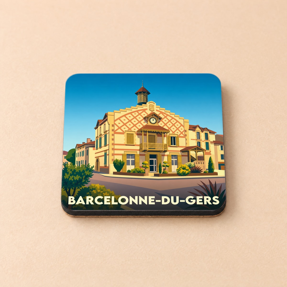 Dessous de verre souvenir de la ville de Barcelonne-du-Gers avec une illustration stylisée de sa mairie.