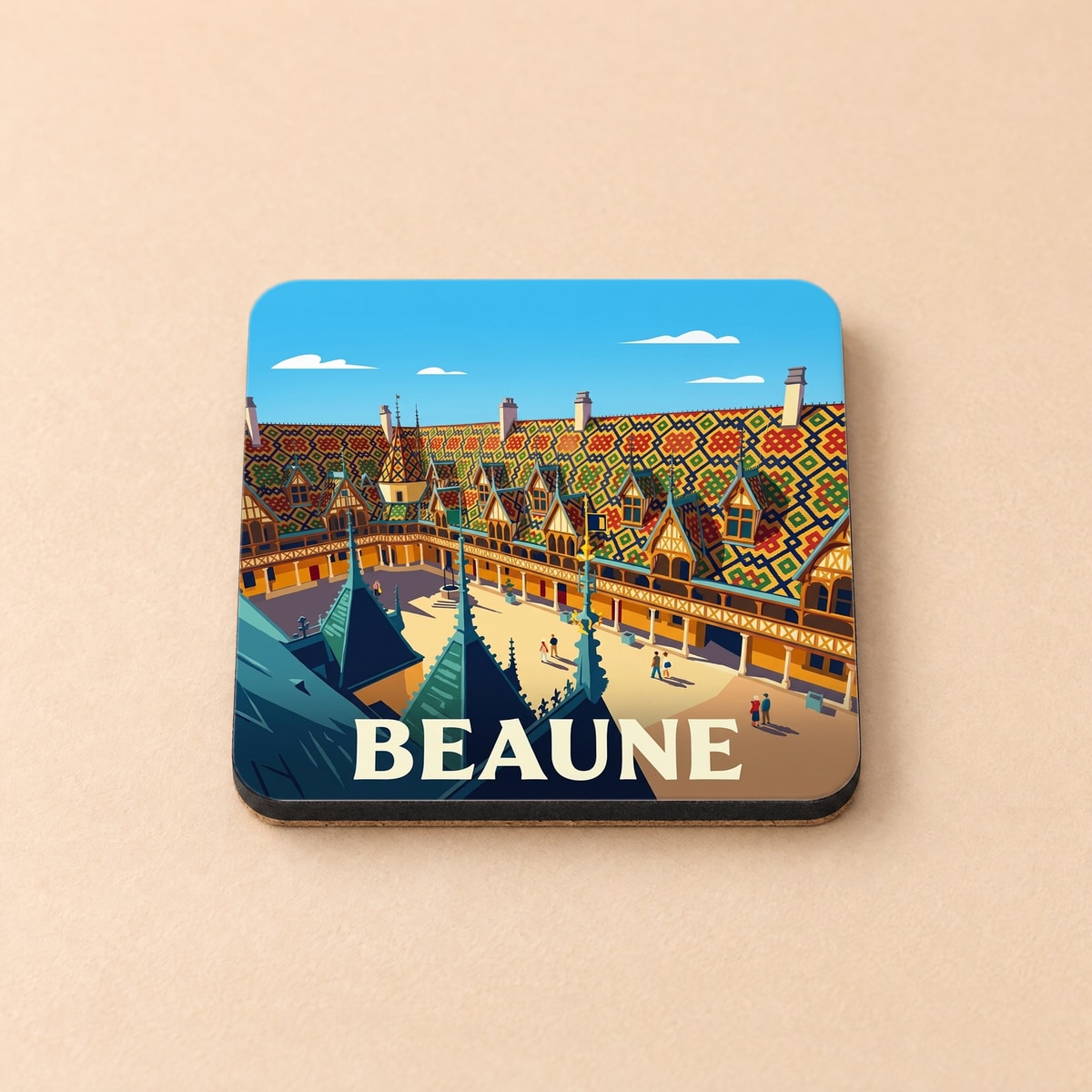 Dessous de verre souvenir de la ville de Beaune avec une illustration stylisée des Hospices et de leurs toits colorés.