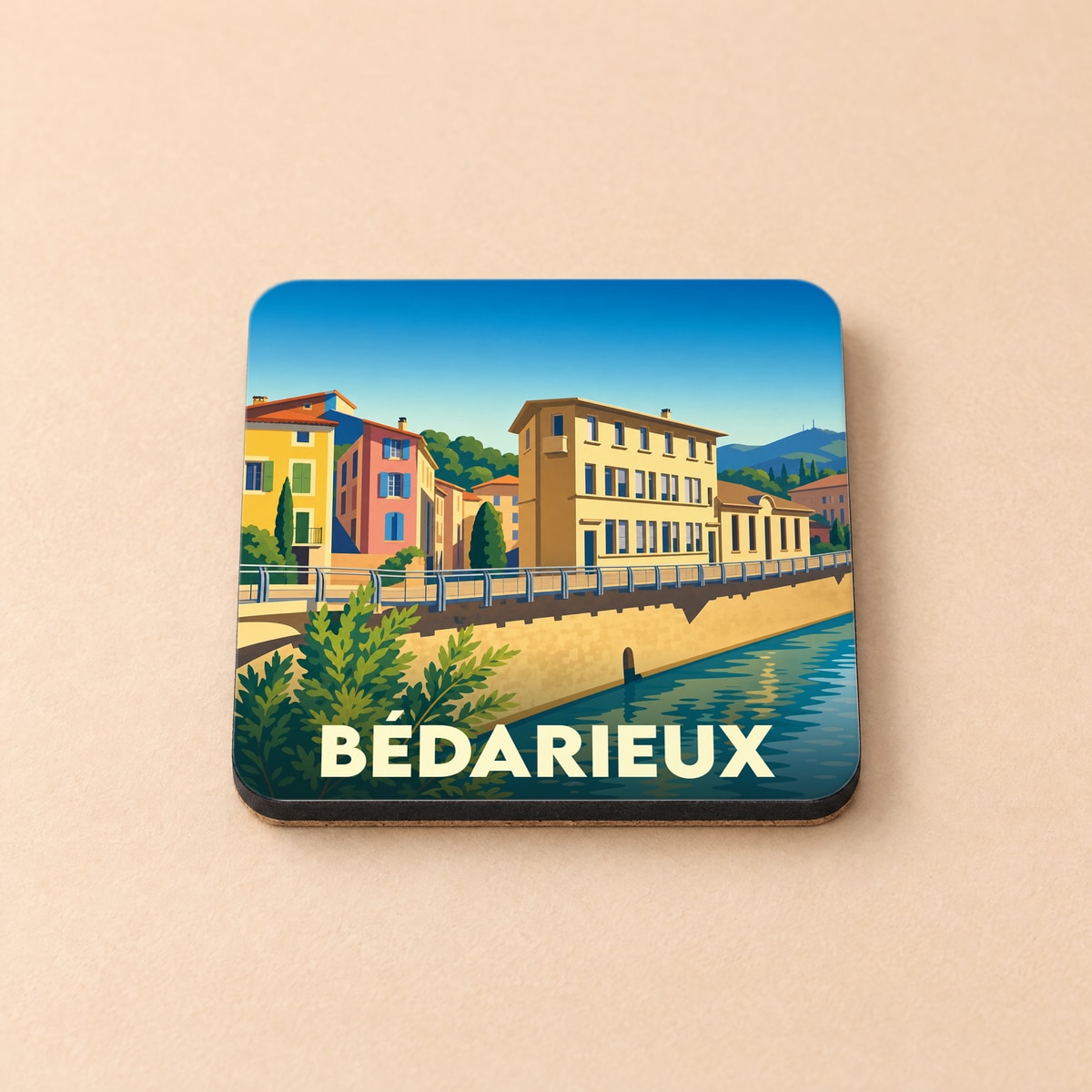 Dessous de verre souvenir de la ville de Bédarieux avec une illustration stylisée des bords de l'Orb.