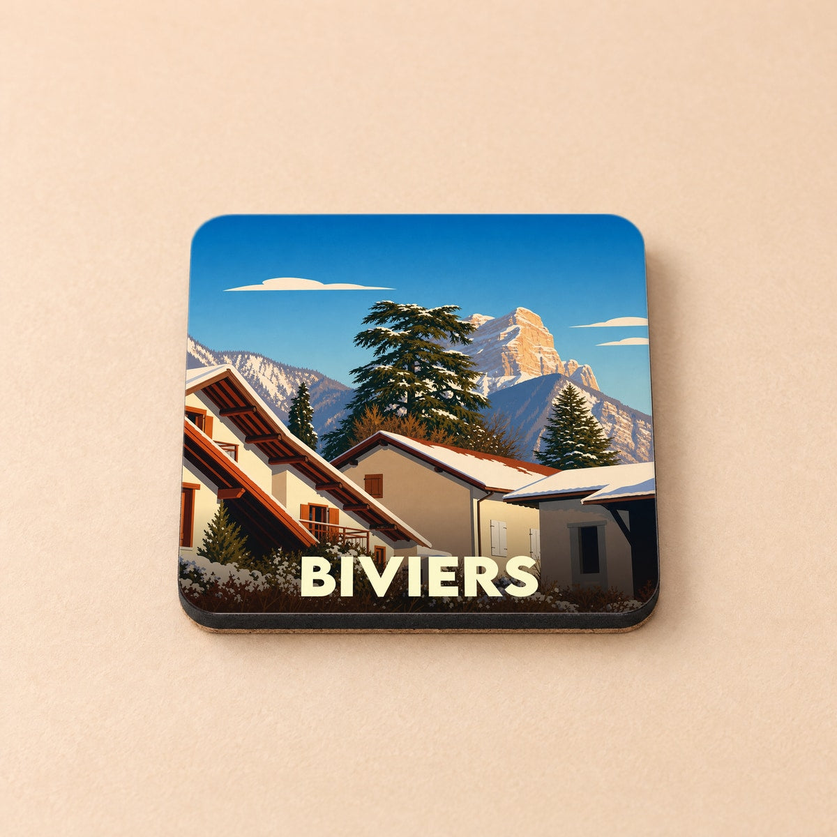 Dessous de verre souvenir de la ville de Biviers avec une illustration hivernale stylisée des montagnes environnantes.