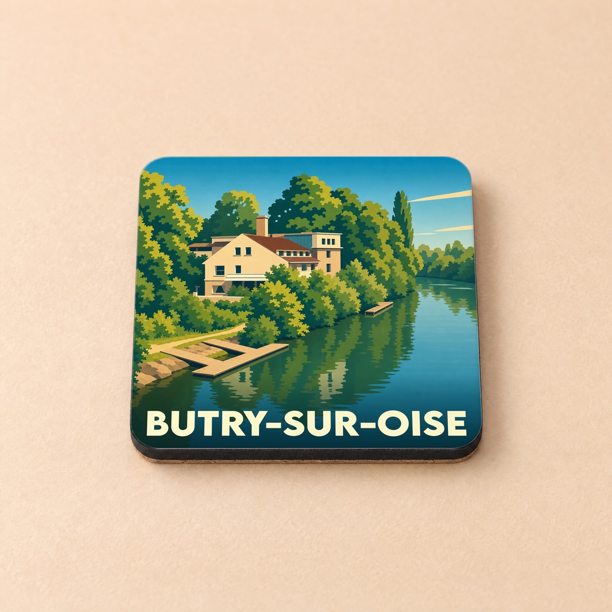 Dessous de verre souvenir de la ville de Butry-sur-Oise avec une illustration stylisée d'une maison au bord de l'eau.