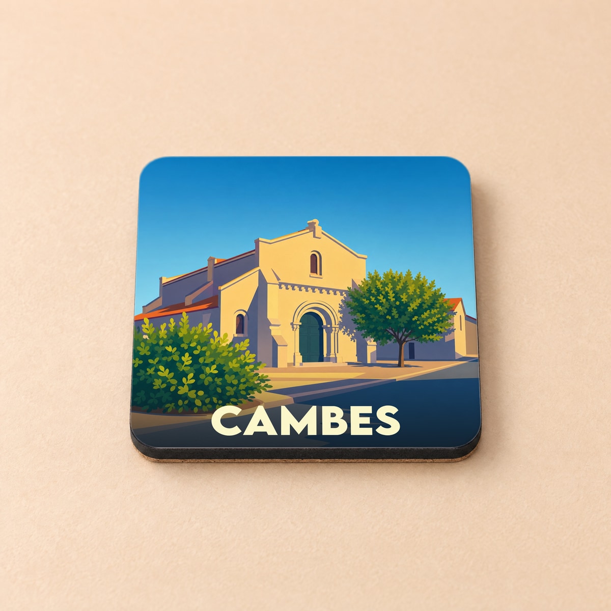 Dessous de verre souvenir de la ville de Cambes avec une illustration stylisée de son église.