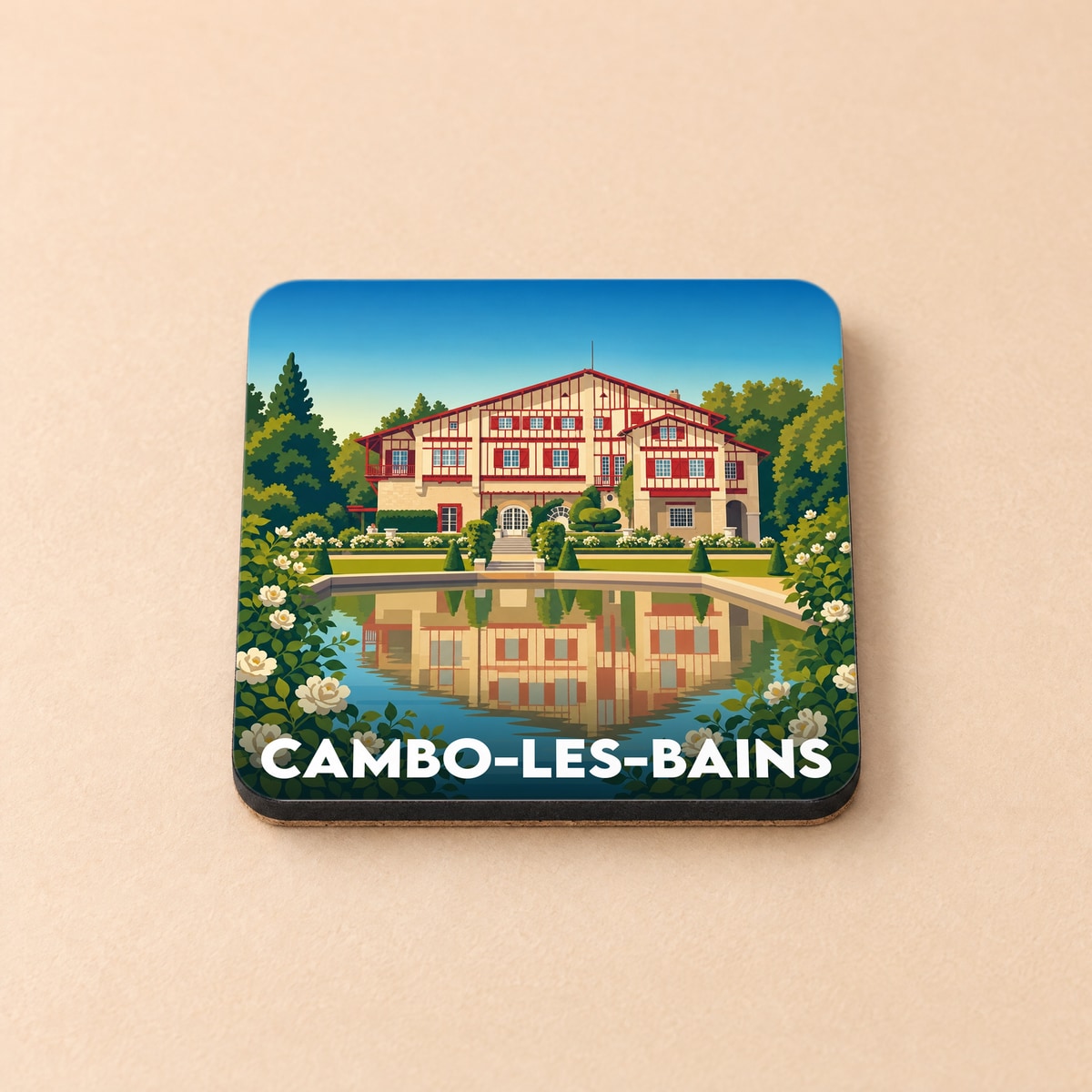 Dessous de verre souvenir de la ville de Cambo-les-Bains avec une illustration stylisée de la Villa Arnaga.