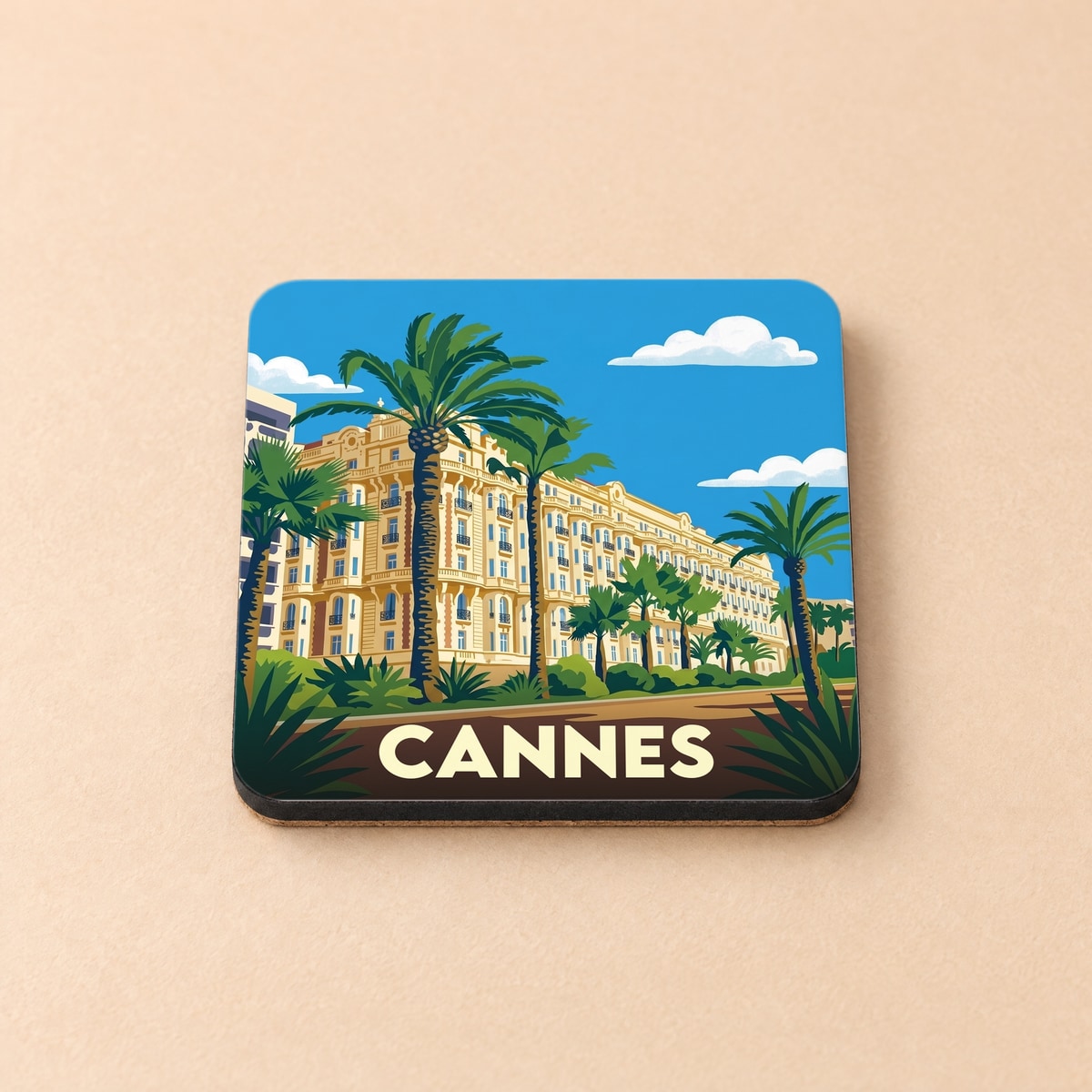 Dessous de verre souvenir de la ville de Cannes avec une illustration stylisée de la Croisette.