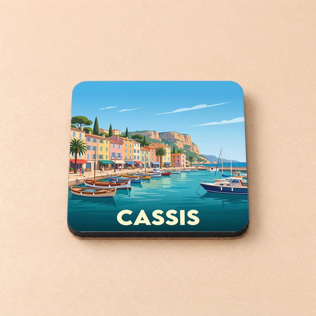 Dessous de verre souvenir de la ville de Cassis avec une illustration stylisée de son port.