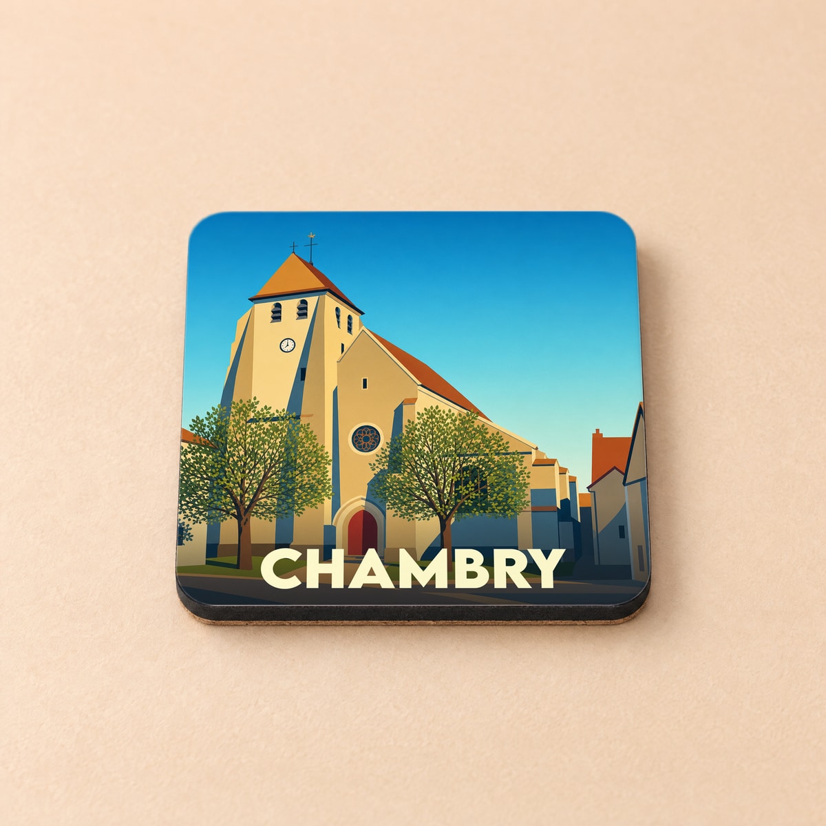 Dessous de verre souvenir de la ville de Chambry avec une illustration stylisée de son église.