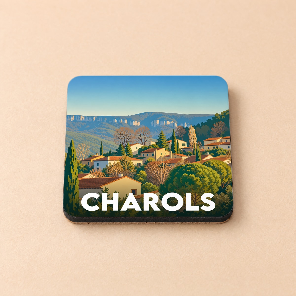 Dessous de verre souvenir de la ville de Charols avec une illustration stylisée de son paysage vallonné.