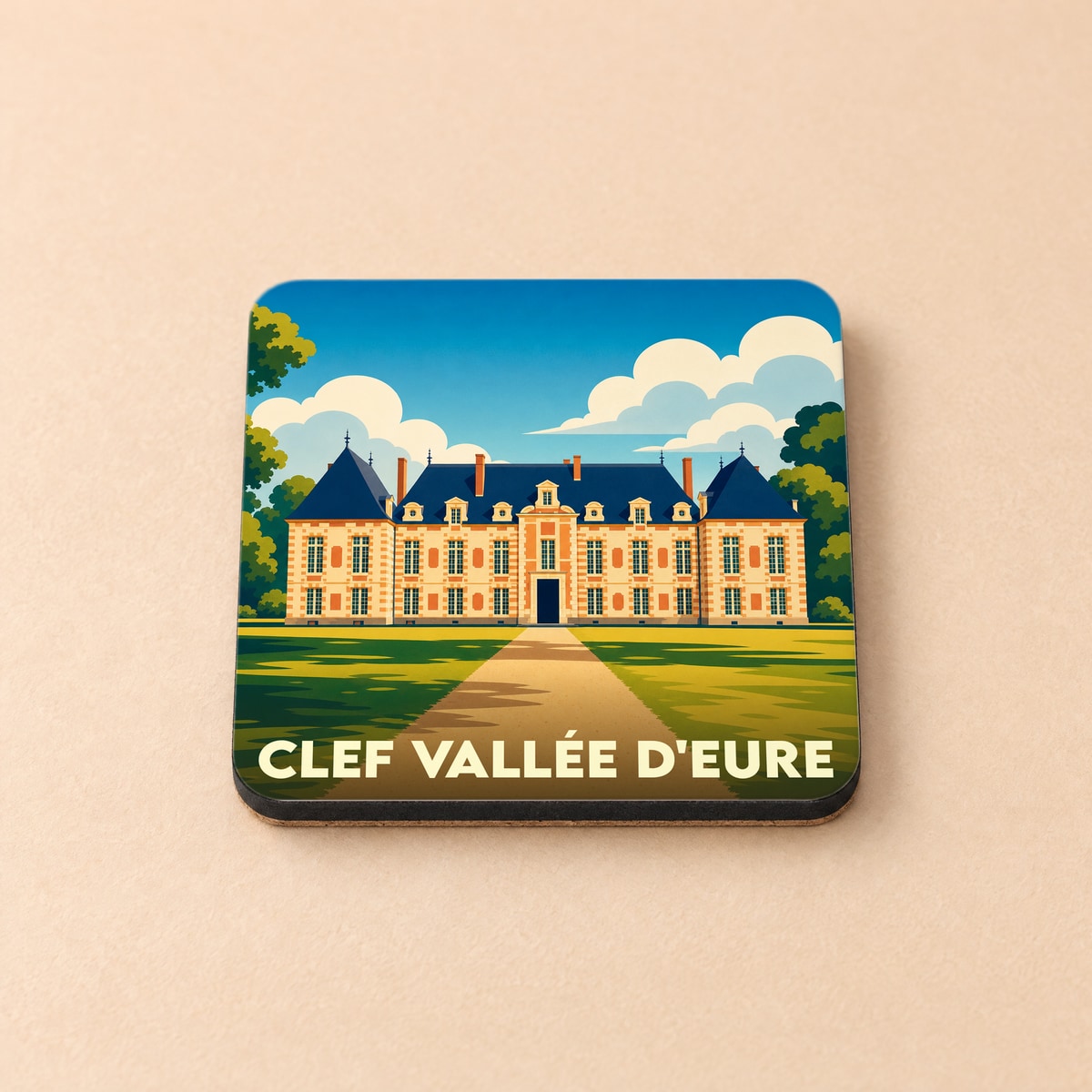 Dessous de verre souvenir de la ville de Clef Vallée d'Eure illustré d'un château stylisé.