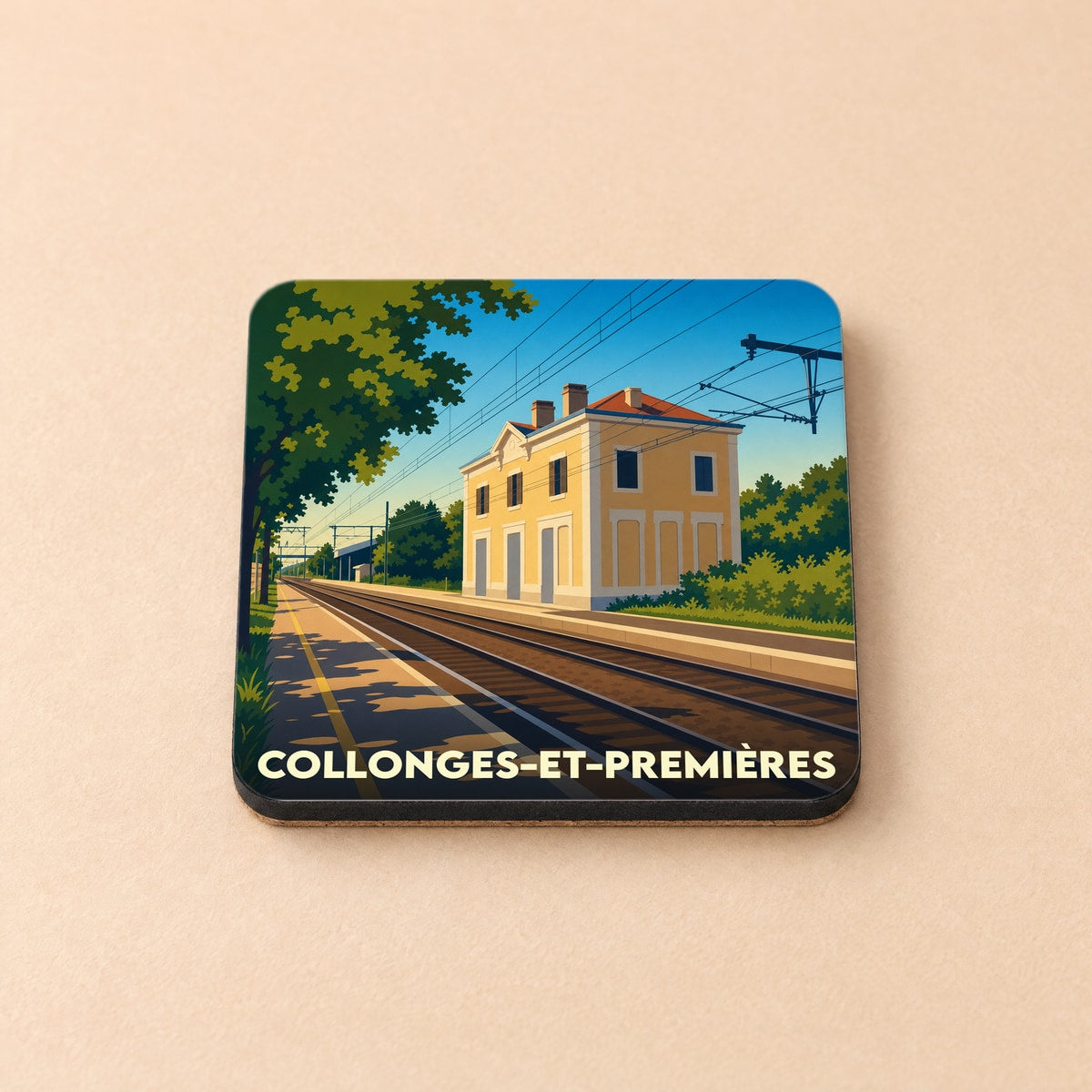 Dessous de verre souvenir de la ville de Collonges-et-Premières avec une illustration stylisée de sa gare ferroviaire.