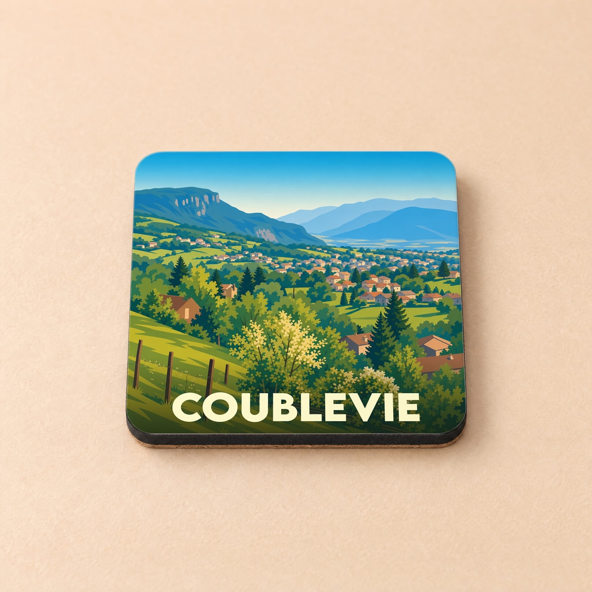Dessous de verre souvenir de la ville de Coublevie avec une illustration paysagère stylisée.