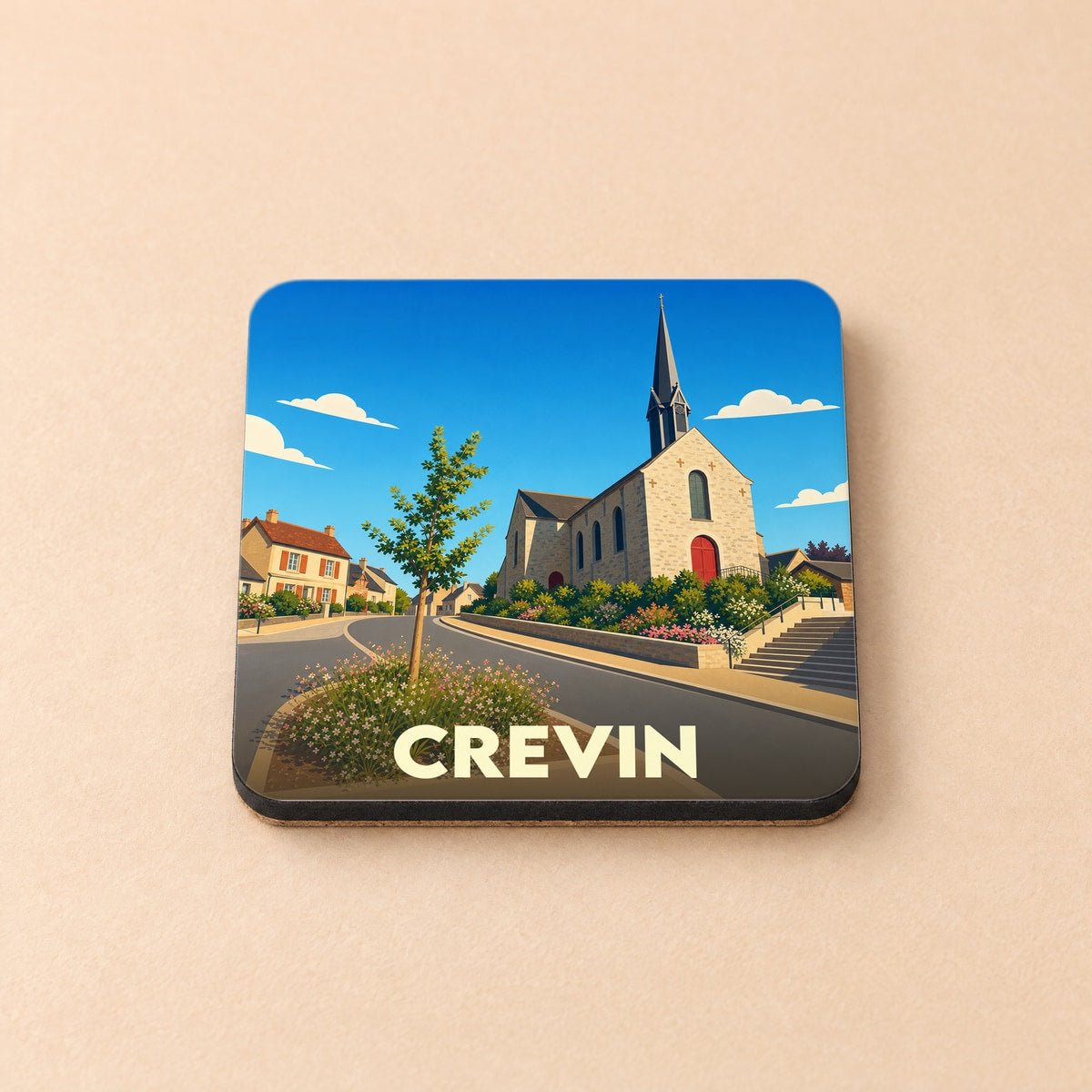 Dessous de verre souvenir de la ville de Crevin avec une illustration stylisée de son église et de ses rues.