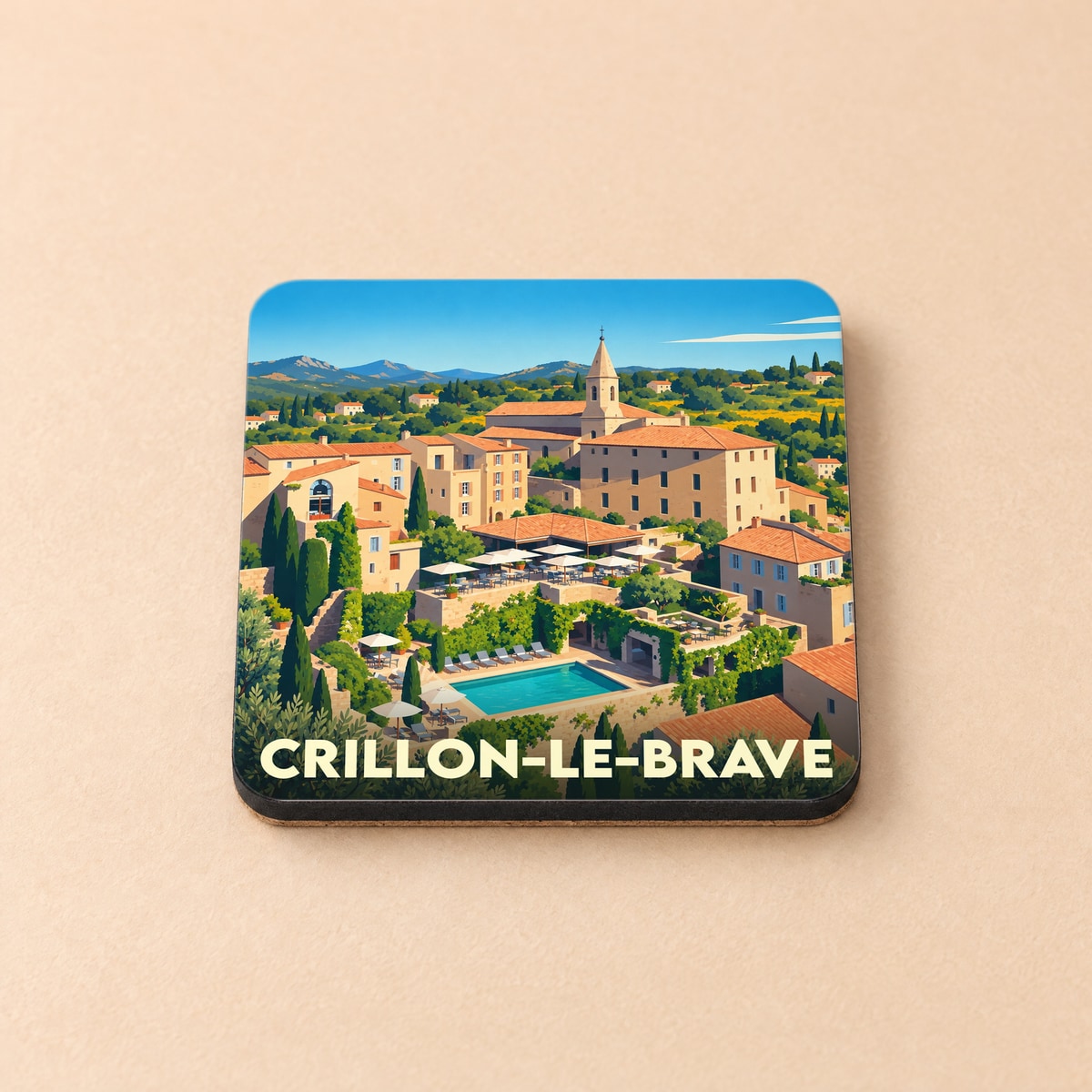 Dessous de verre souvenir de la ville de Crillon-le-Brave avec une illustration stylisée du village et de sa piscine.
