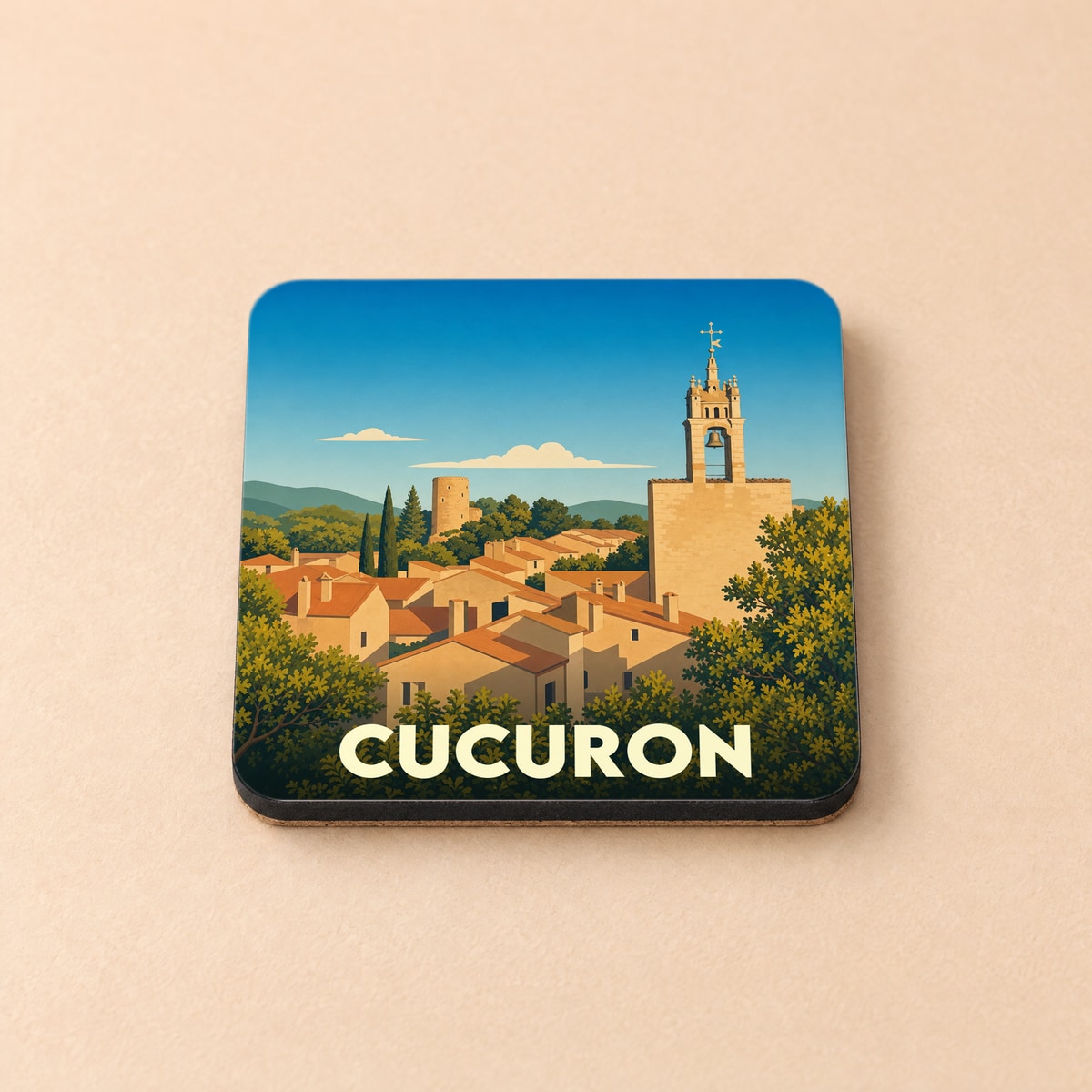 Dessous de verre souvenir de la ville de Cucuron avec une illustration stylisée de ses toits provençaux et de son clocher.