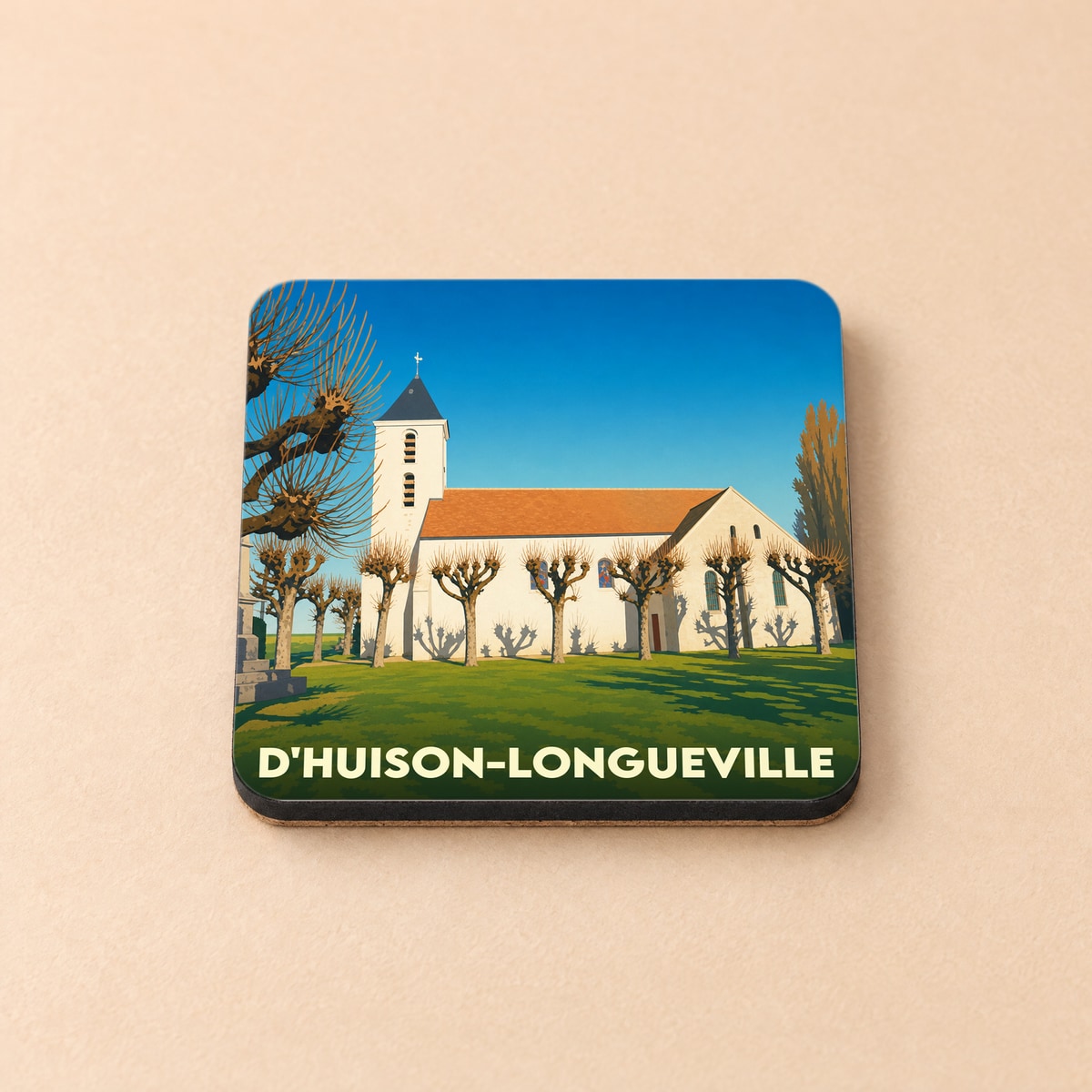 Dessous de verre souvenir de la ville de D'Huison-Longueville avec une illustration stylisée de son église.