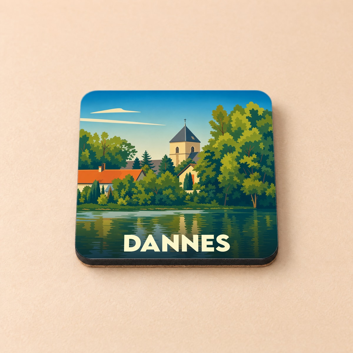 Dessous de verre souvenir de la ville de Dannes avec une illustration stylisée d'un paysage au bord de l'eau.