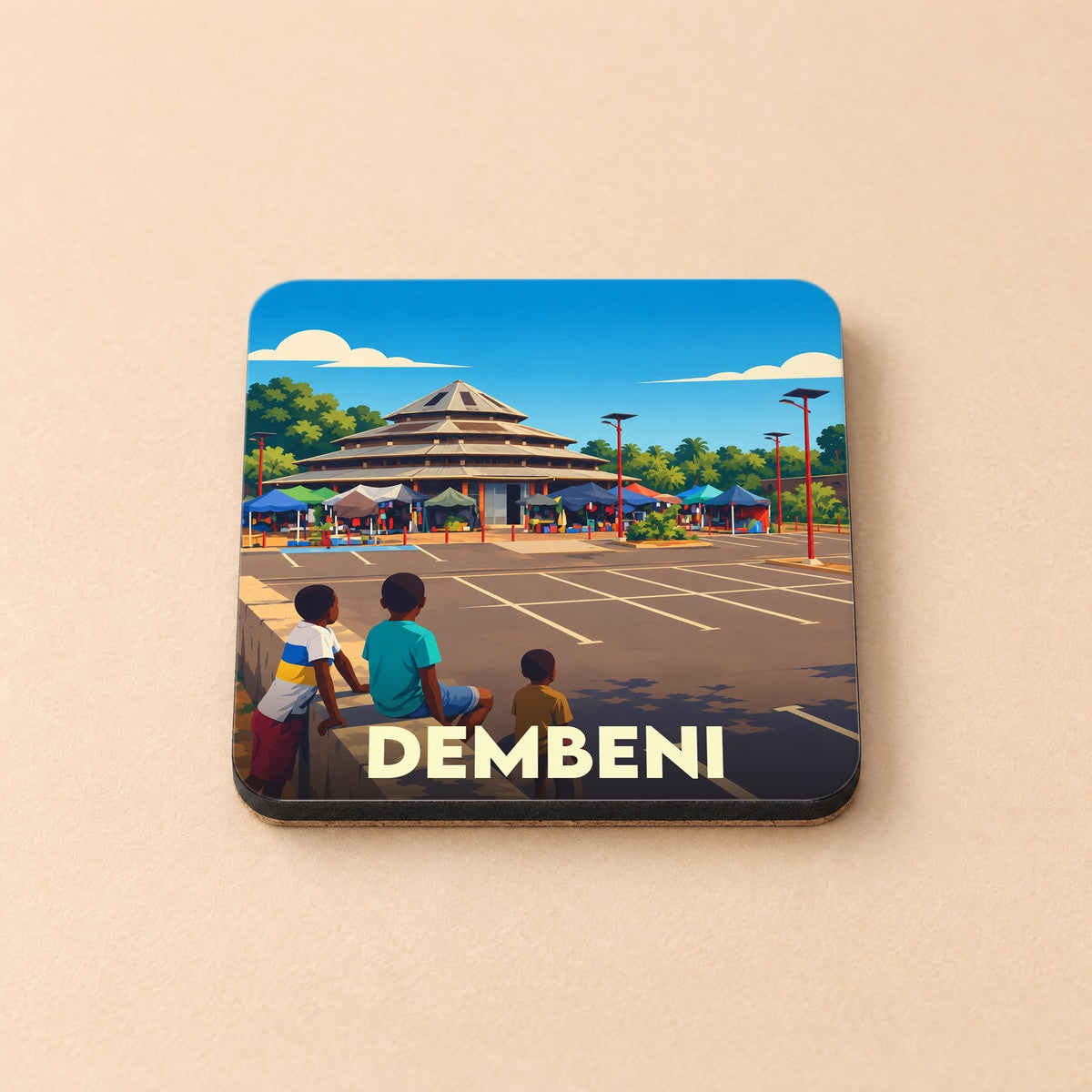 Dessous de verre souvenir de la ville de Dembeni avec une illustration stylisée.