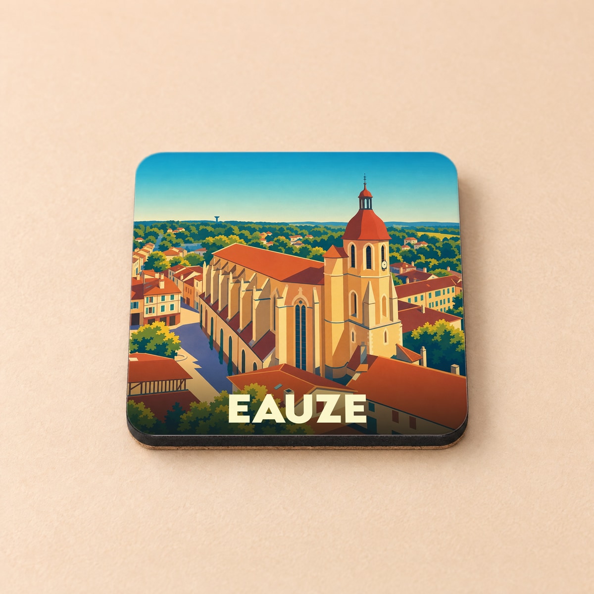 Dessous de verre souvenir de la ville d'Eauze avec une illustration stylisée de sa cathédrale.