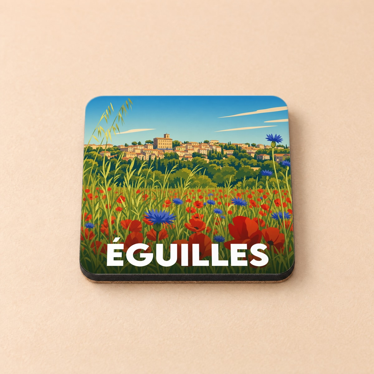Dessous de verre souvenir de la ville d'Éguilles illustré d'un paysage de Provence fleuri de coquelicots.
