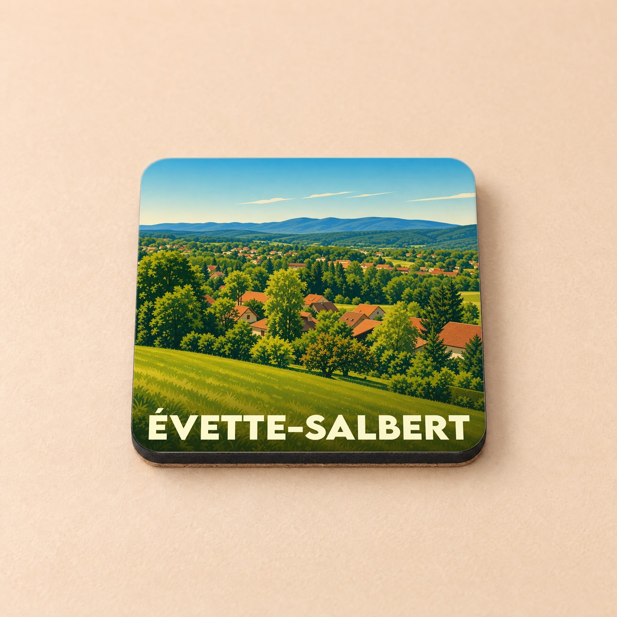Dessous de verre souvenir de la ville de Évette-Salbert avec une illustration paysagère stylisée.