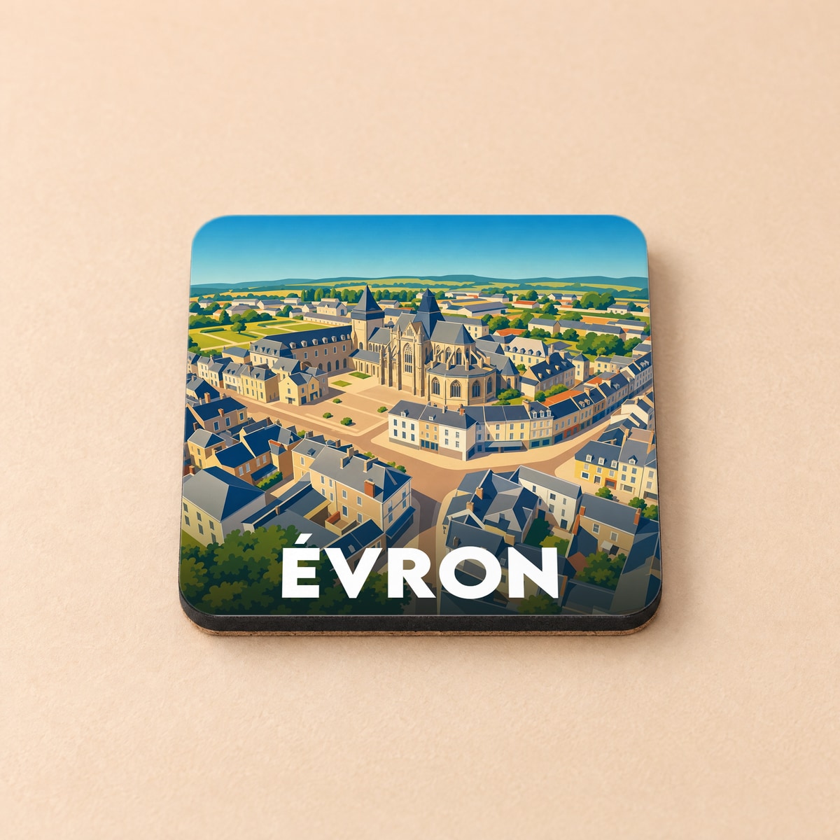 Dessous de verre souvenir de la ville de Évron avec une illustration stylisée vue du ciel.