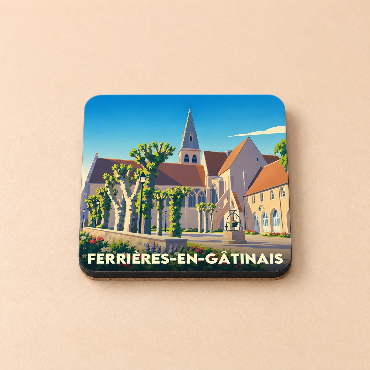Dessous de verre souvenir de Ferrières-en-Gâtinais avec une illustration stylisée de son abbaye.