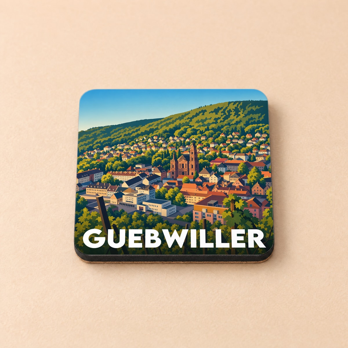 Dessous de verre souvenir de la ville de Guebwiller avec une illustration stylisée et colorée.