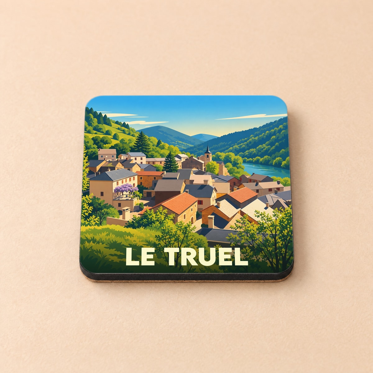 Dessous de verre souvenir de la ville de Le Truel avec une illustration stylisée d'un village de montagne.