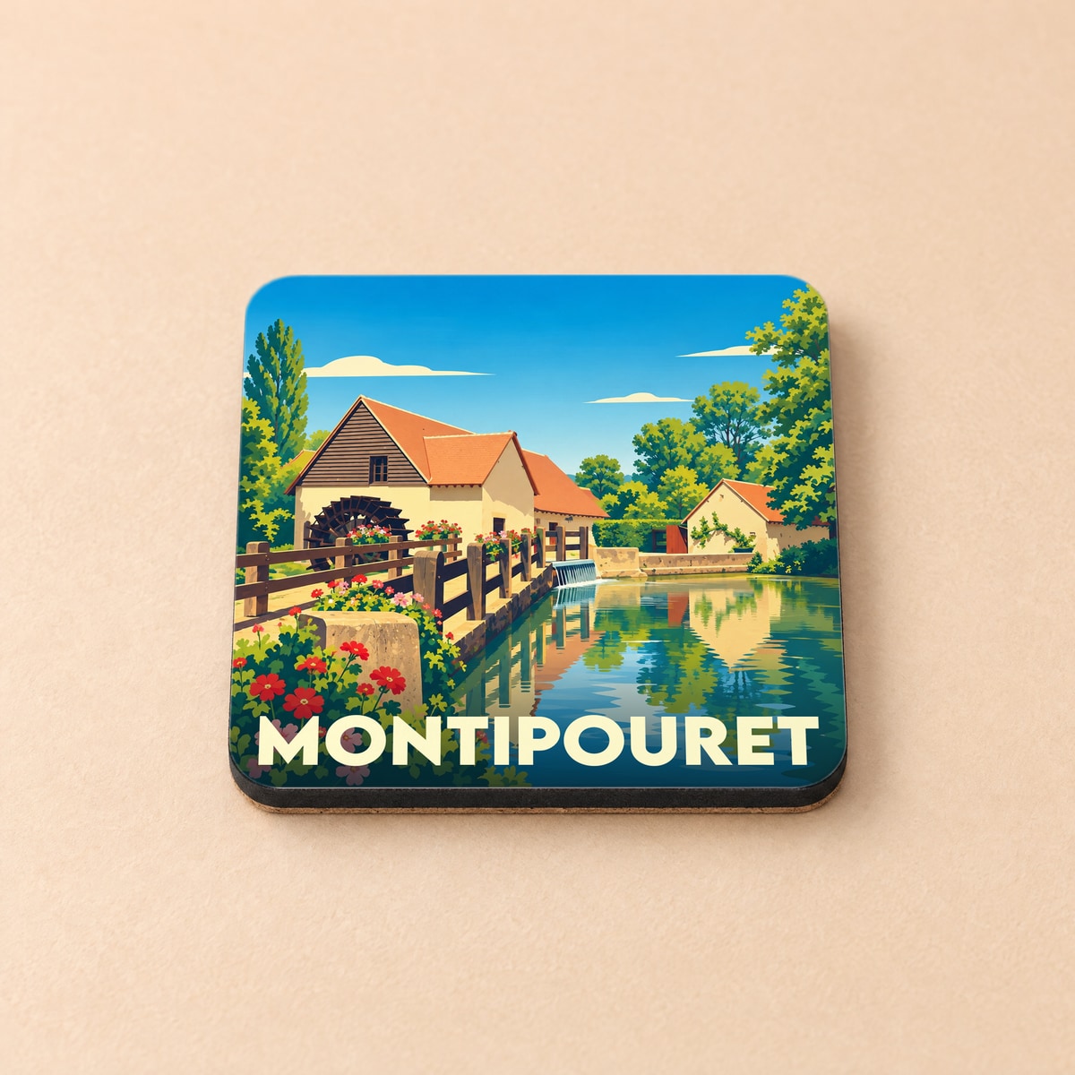 Dessous de verre souvenir de la ville de Montipouret avec une illustration stylisée d'un moulin à eau.