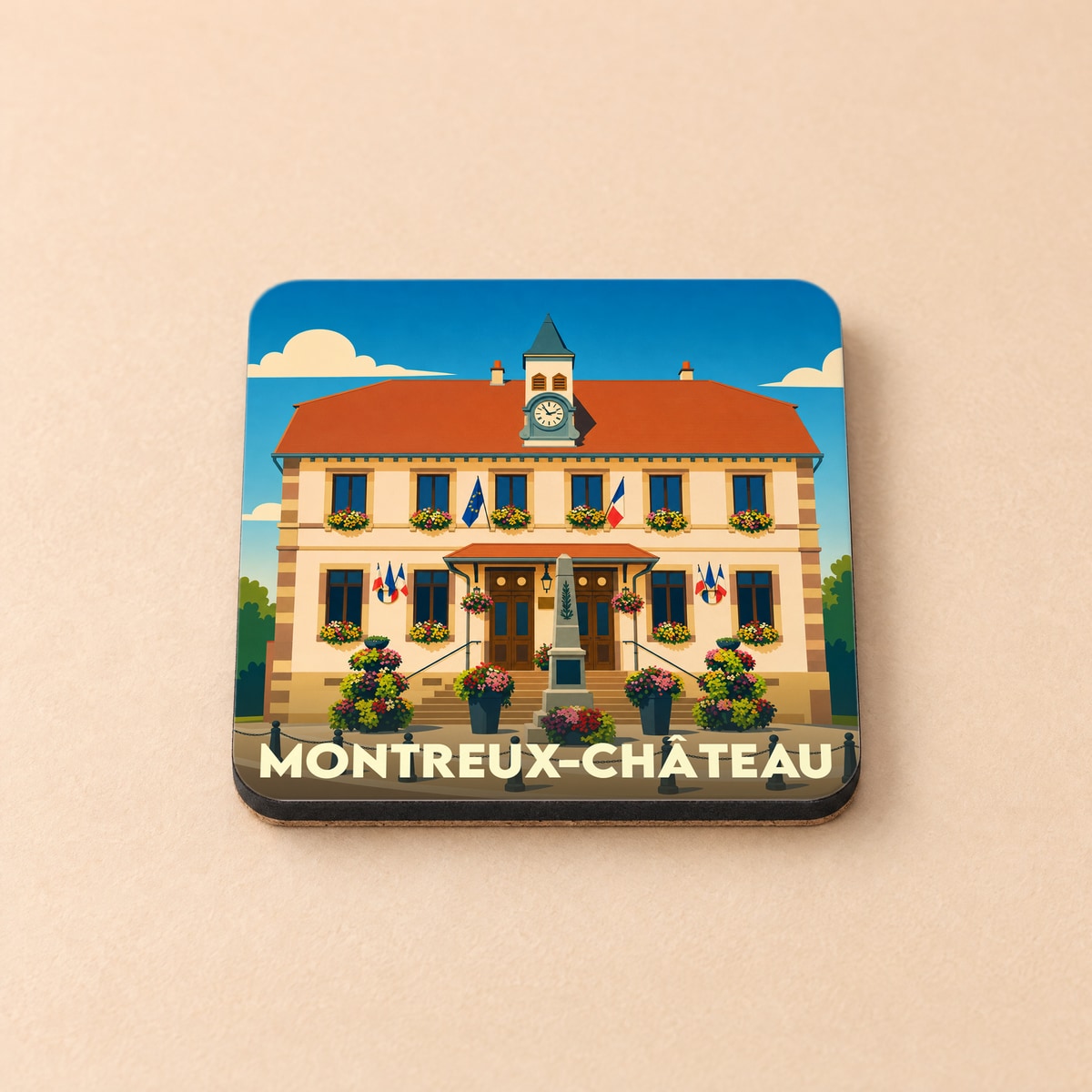 Dessous de verre souvenir de la ville de Montreux-Château avec une illustration stylisée de sa mairie fleurie.