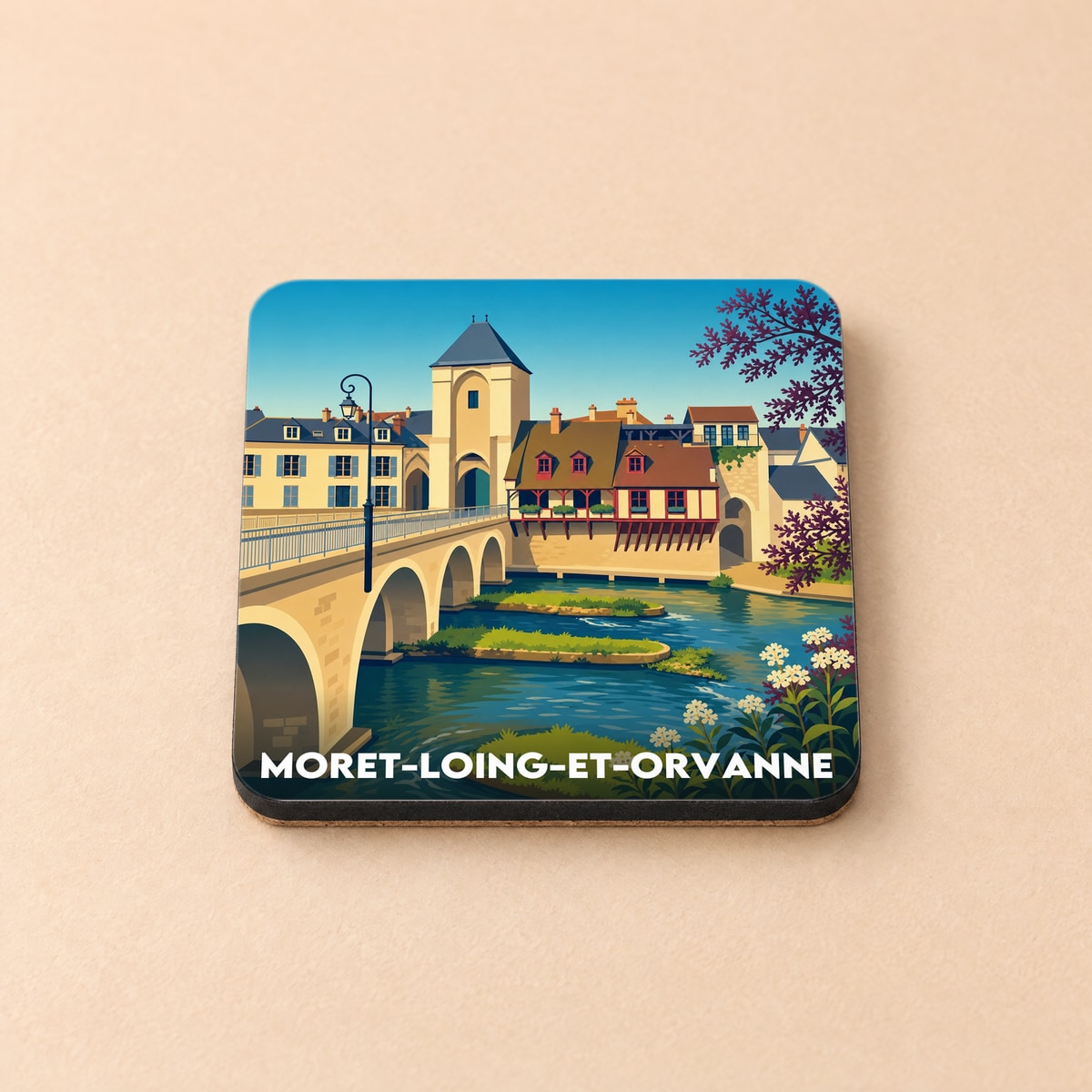 Dessous de verre souvenir de la ville de Moret-Loing-et-Orvanne avec une illustration stylisée du pont et de ses moulins.
