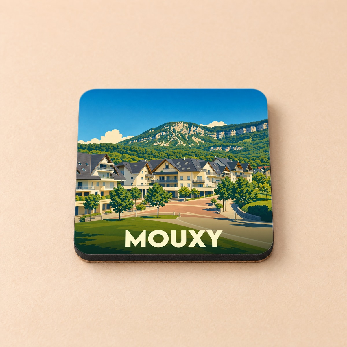 Dessous de verre souvenir de la ville de Mouxy avec une illustration stylisée d'un paysage montagneux.