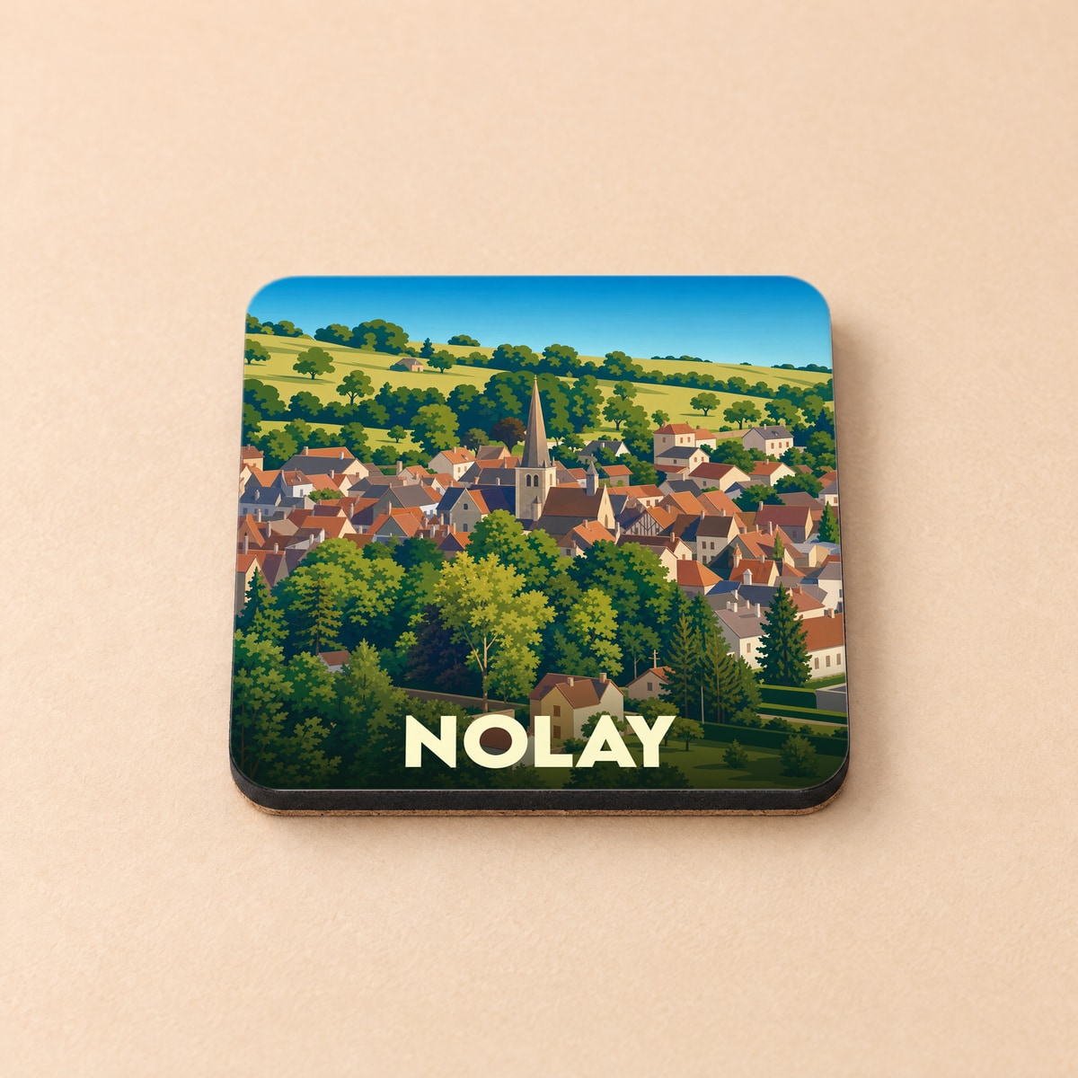 Dessous de verre souvenir de la ville de Nolay avec une illustration stylisée de ses toits et de son église.