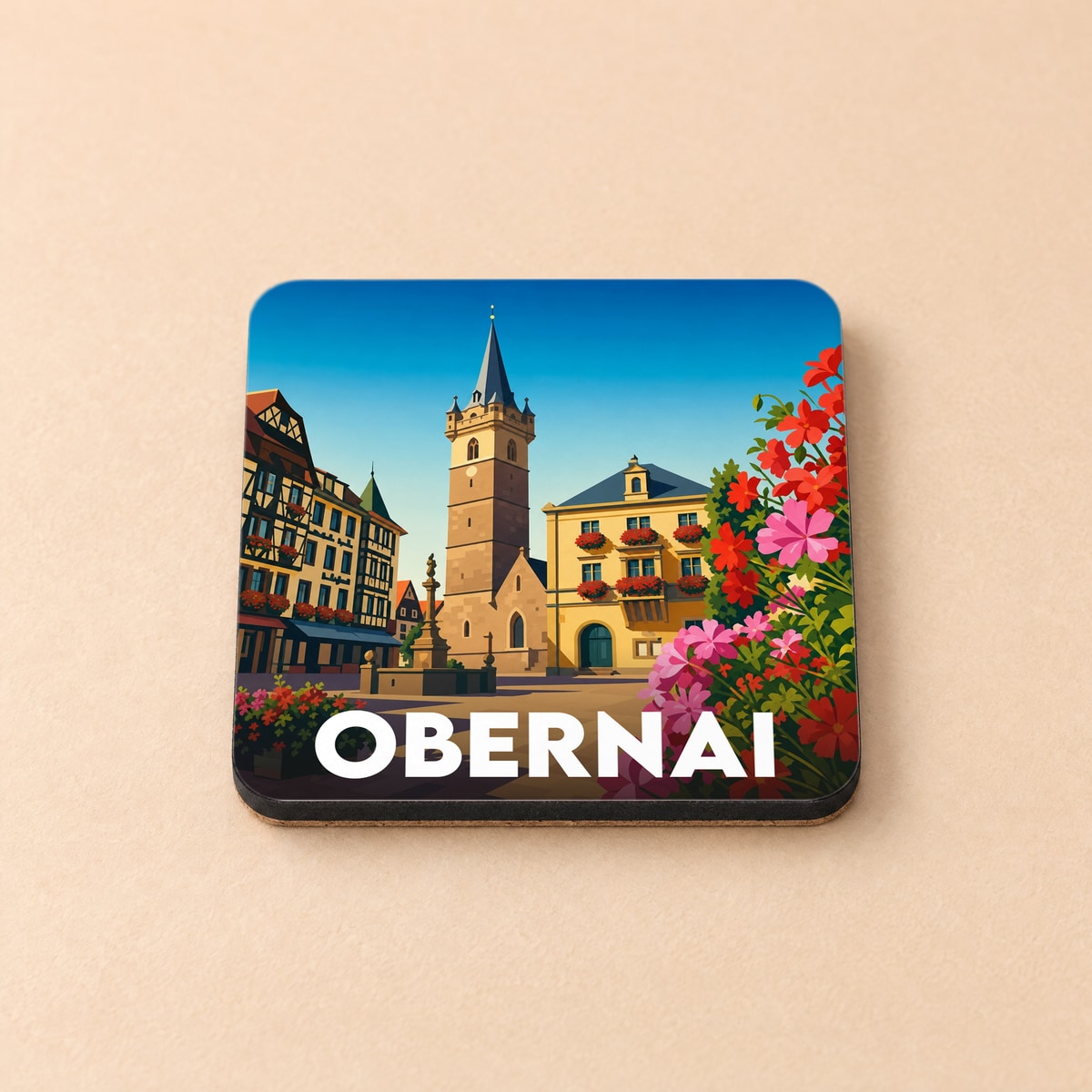 Dessous de verre souvenir de la ville d'Obernai avec une illustration stylisée de sa place historique fleurie.