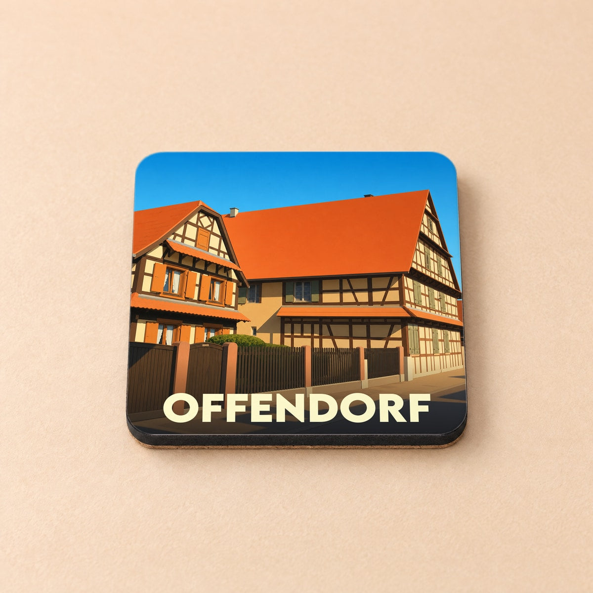 Dessous de verre souvenir de la ville d'Offendorf avec une illustration stylisée de maisons à colombages.
