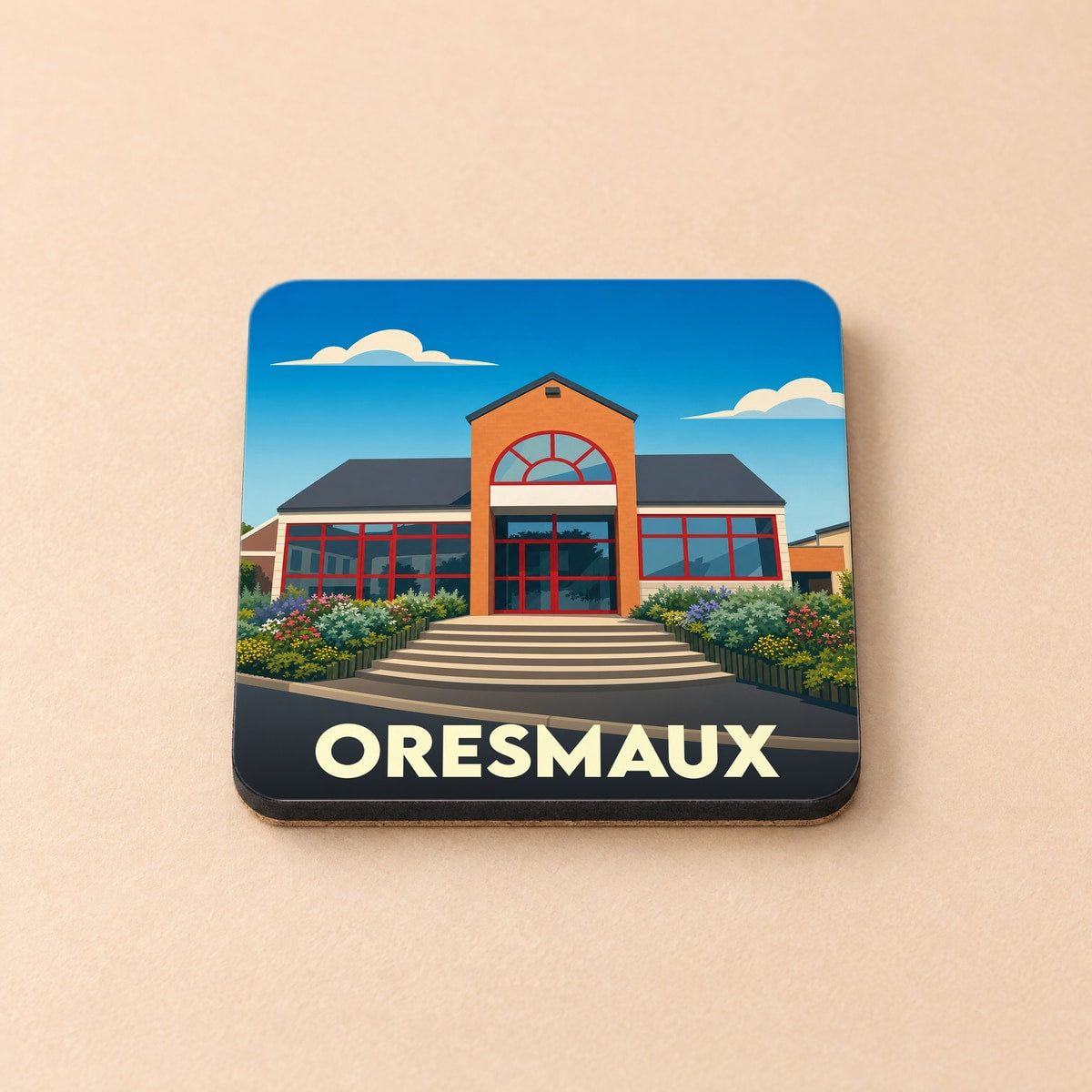 Dessous de verre souvenir de la ville de Oresmaux avec une illustration stylisée de la mairie.