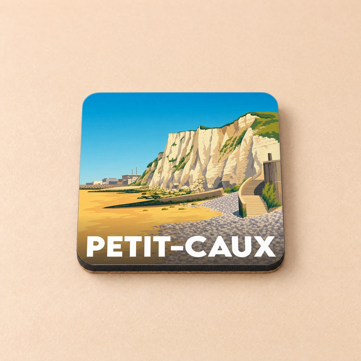 Dessous de verre souvenir de la ville de Petit-Caux avec une illustration stylisée de ses falaises.