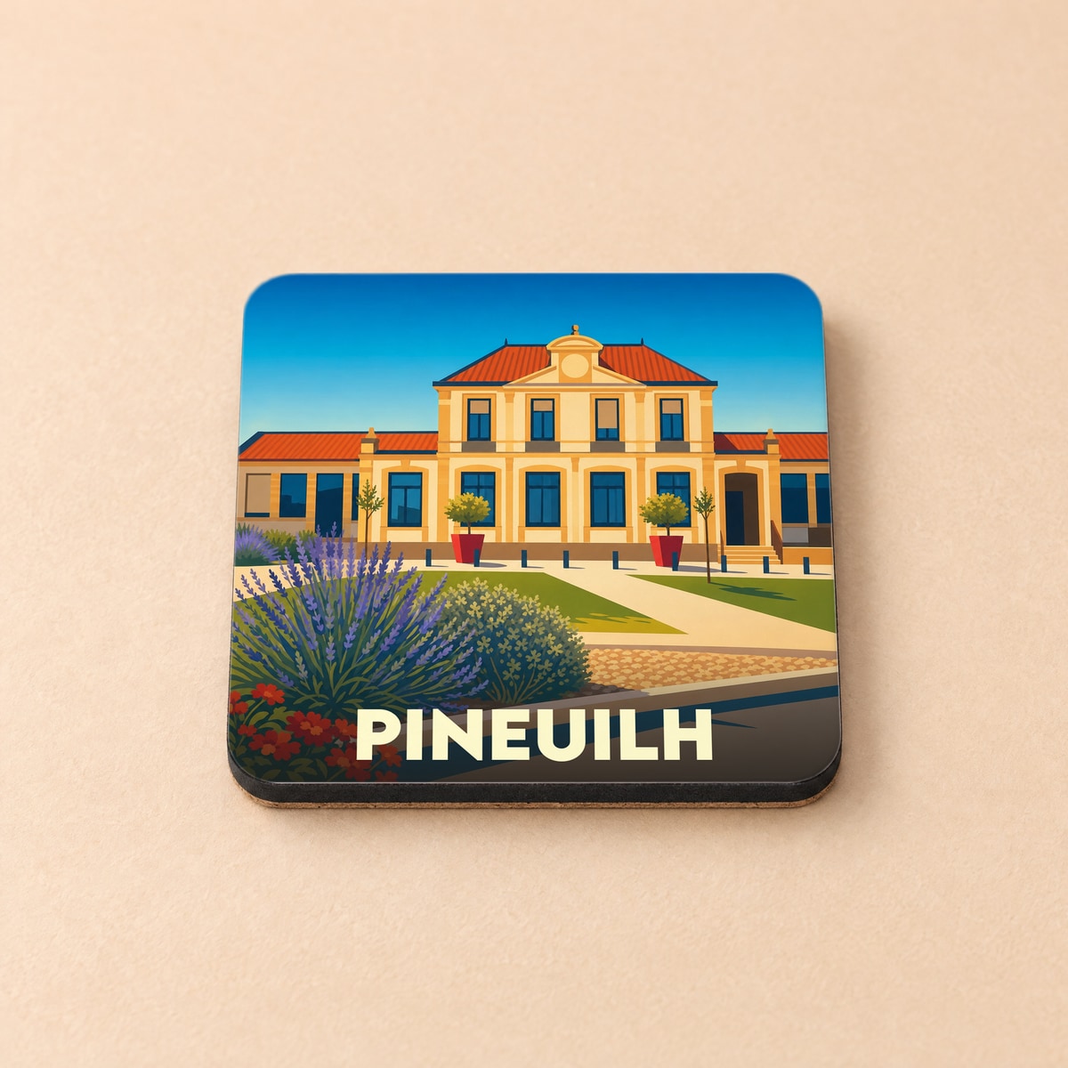 Dessous de verre souvenir de la ville de Pineuilh avec une illustration stylisée d'un bâtiment public.