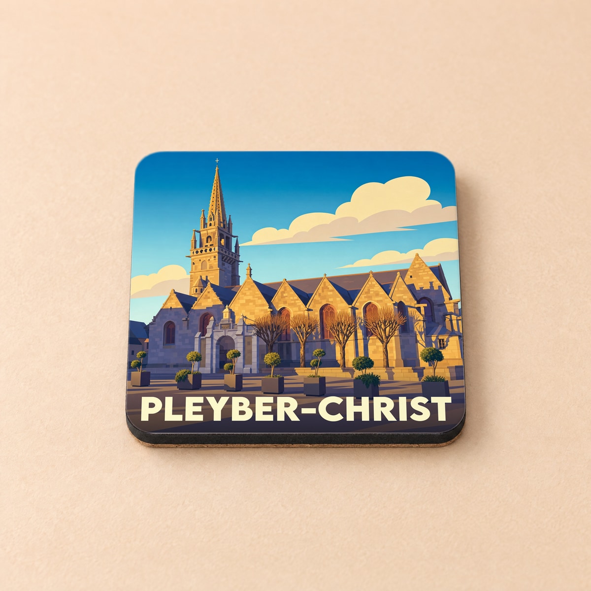 Dessous de verre souvenir de la ville de Pleyber-Christ avec une illustration stylisée de son église.